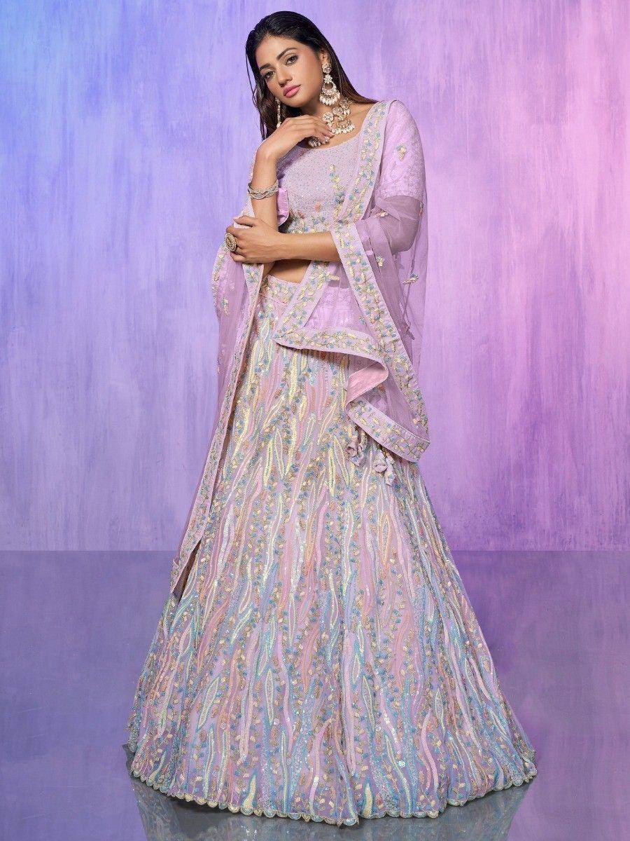 Pastel purple lehenga choli with intricate embroidery and sheer dupatta, perfect for Indian weddings and festive occasions