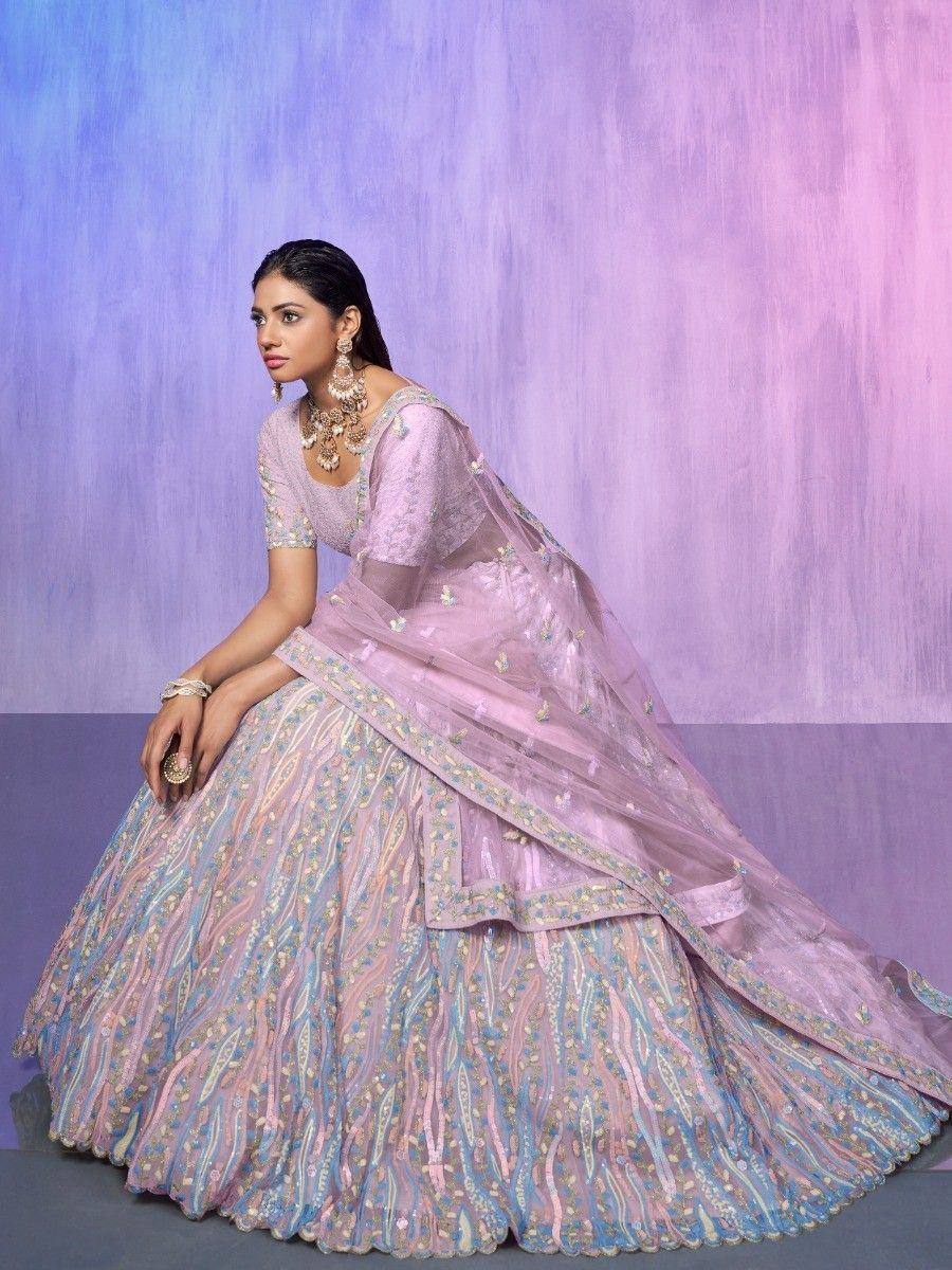 Elegant lavender lehenga choli with intricate embroidery, perfect for Indian weddings and festive occasions.
