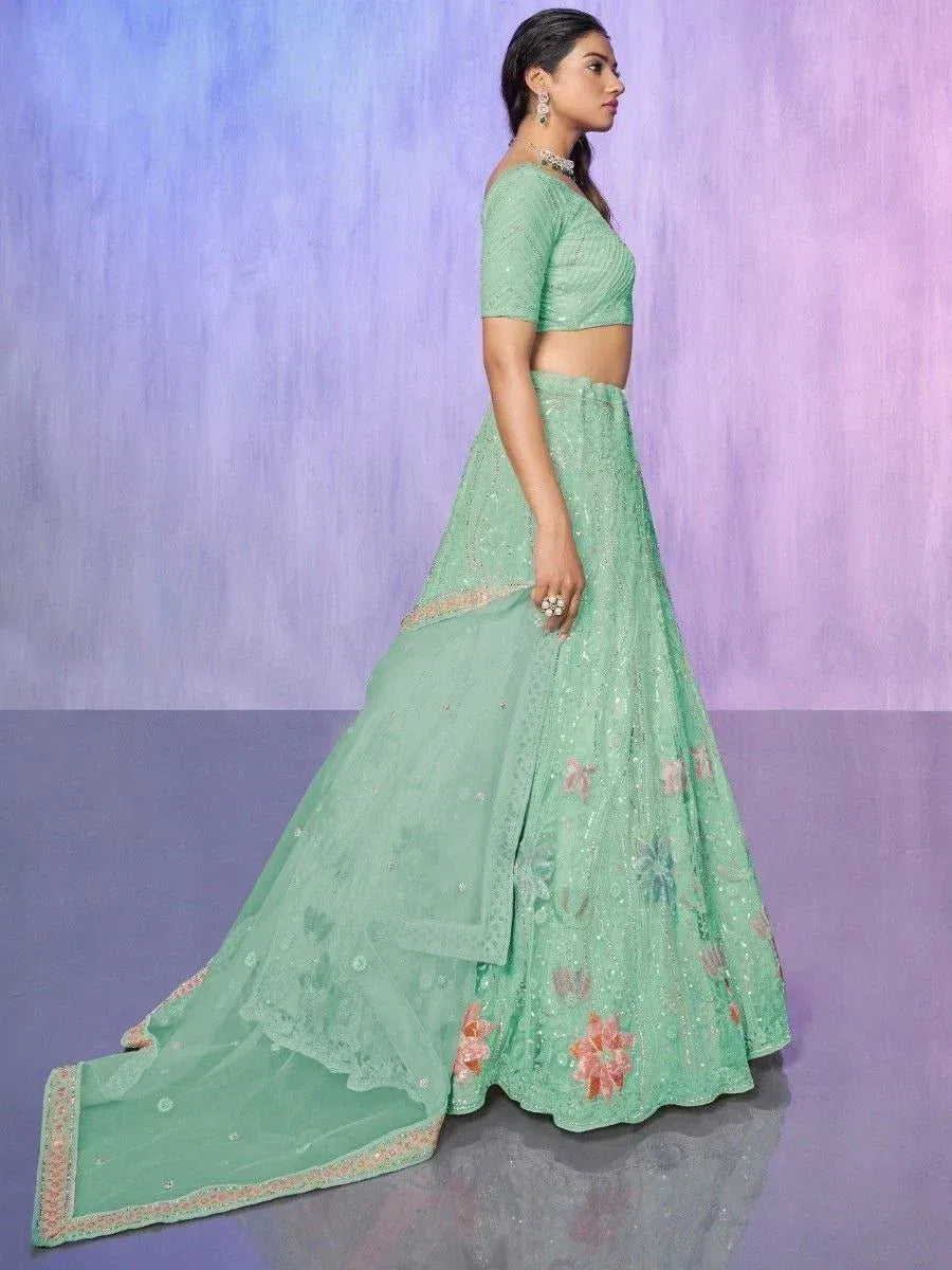 Mint green designer lehenga choli with floral embroidery and sequin detailing, perfect for weddings and parties