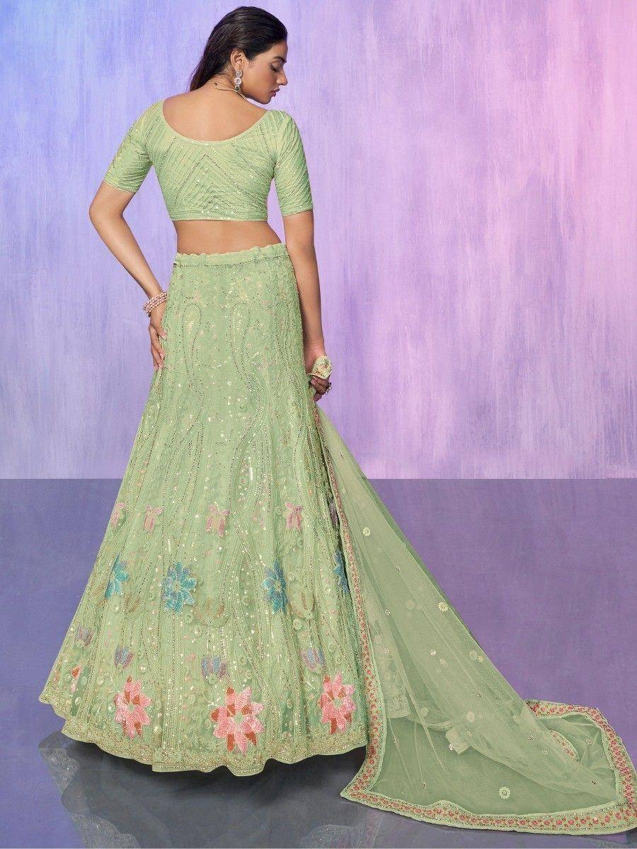 Mint green embroidered lehenga choli with floral motifs and sheer dupatta, perfect for Indian ethnic occasions.