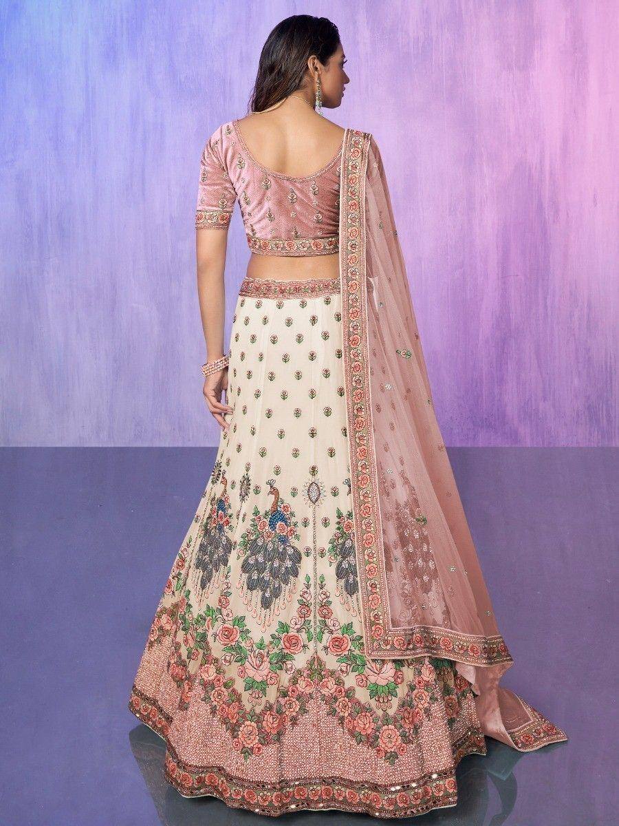 Pink velvet blouse with floral peacock embroidered lehenga choli, perfect for Indian weddings and festivals