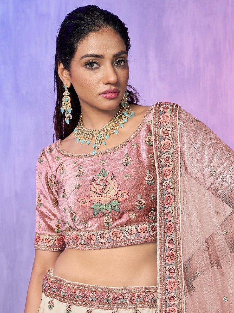 Pink floral embroidered lehenga choli with matching dupatta and turquoise jewelry