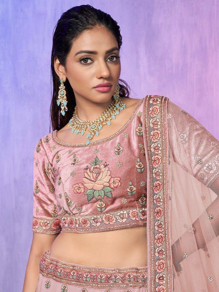 Pink floral embroidered lehenga choli with matching dupatta and turquoise jewelry
