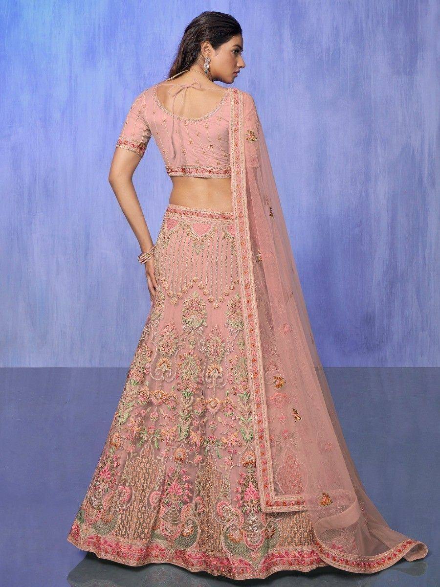 Pink embroidered lehenga choli with floral motifs, perfect for Indian weddings and festive occasions.