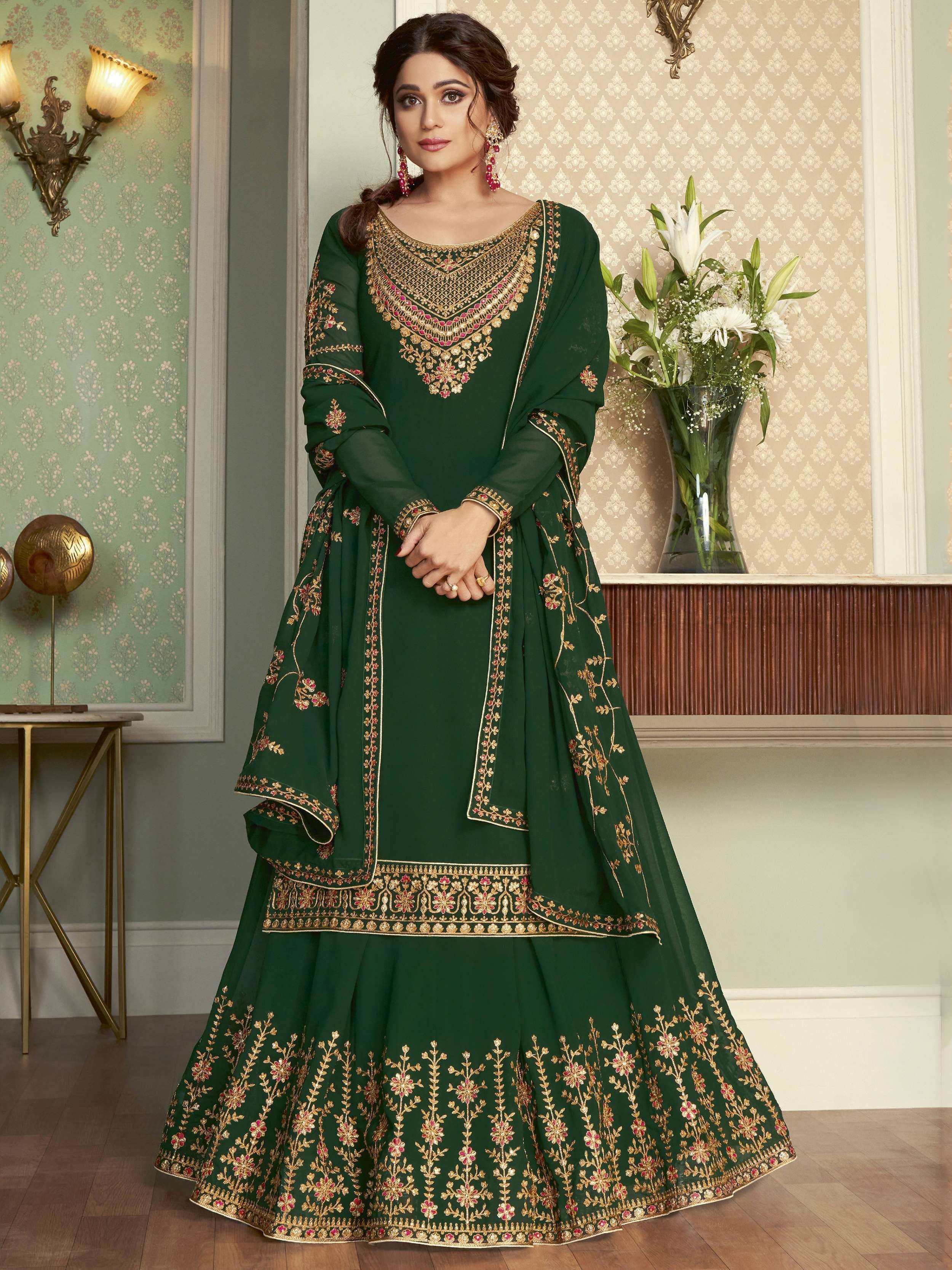 Emerald green embroidered anarkali suit with gold and pink detailing, perfect for Indian ethnic wear occasions.