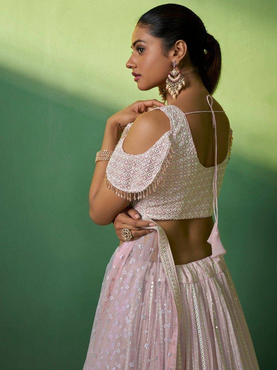 Pink embroidered lehenga choli with open back blouse and mirror work, perfect for Indian ethnic wear