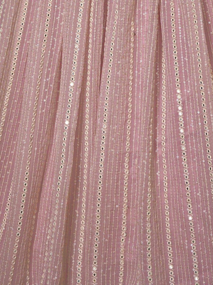Pink ethnic lehenga with gold mirror work and sequin detailing, perfect for weddings and festivals