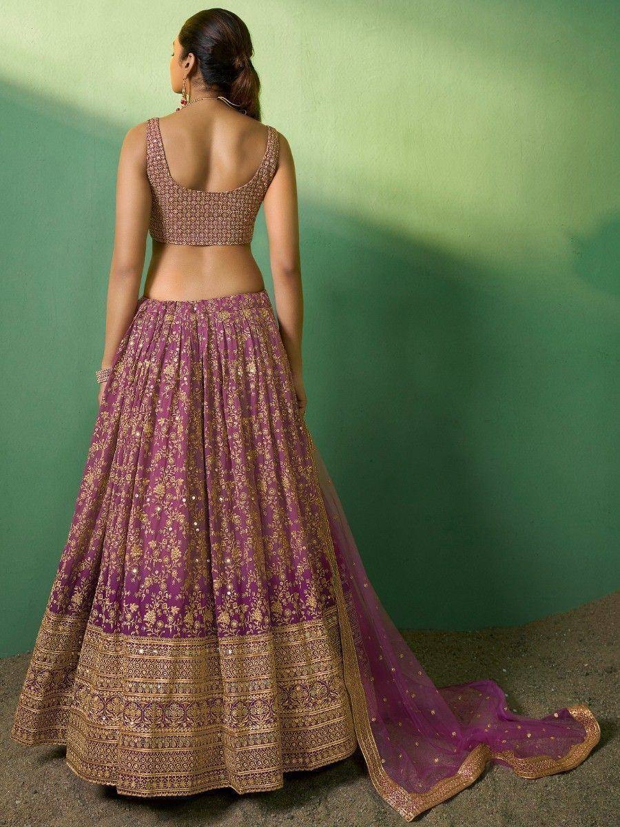 Purple and gold embroidered lehenga choli with backless blouse, perfect for Indian weddings and festive occasions