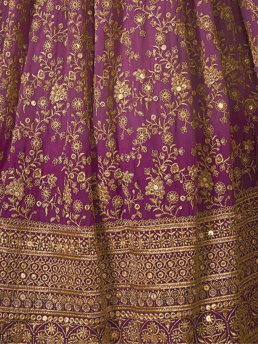 Purple lehenga with gold floral embroidery and intricate border detailing, ethnic wear for festive occasions