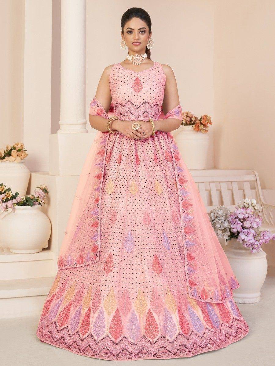 Pink embroidered lehenga choli with leaf motifs, perfect for Indian ethnic occasions and weddings