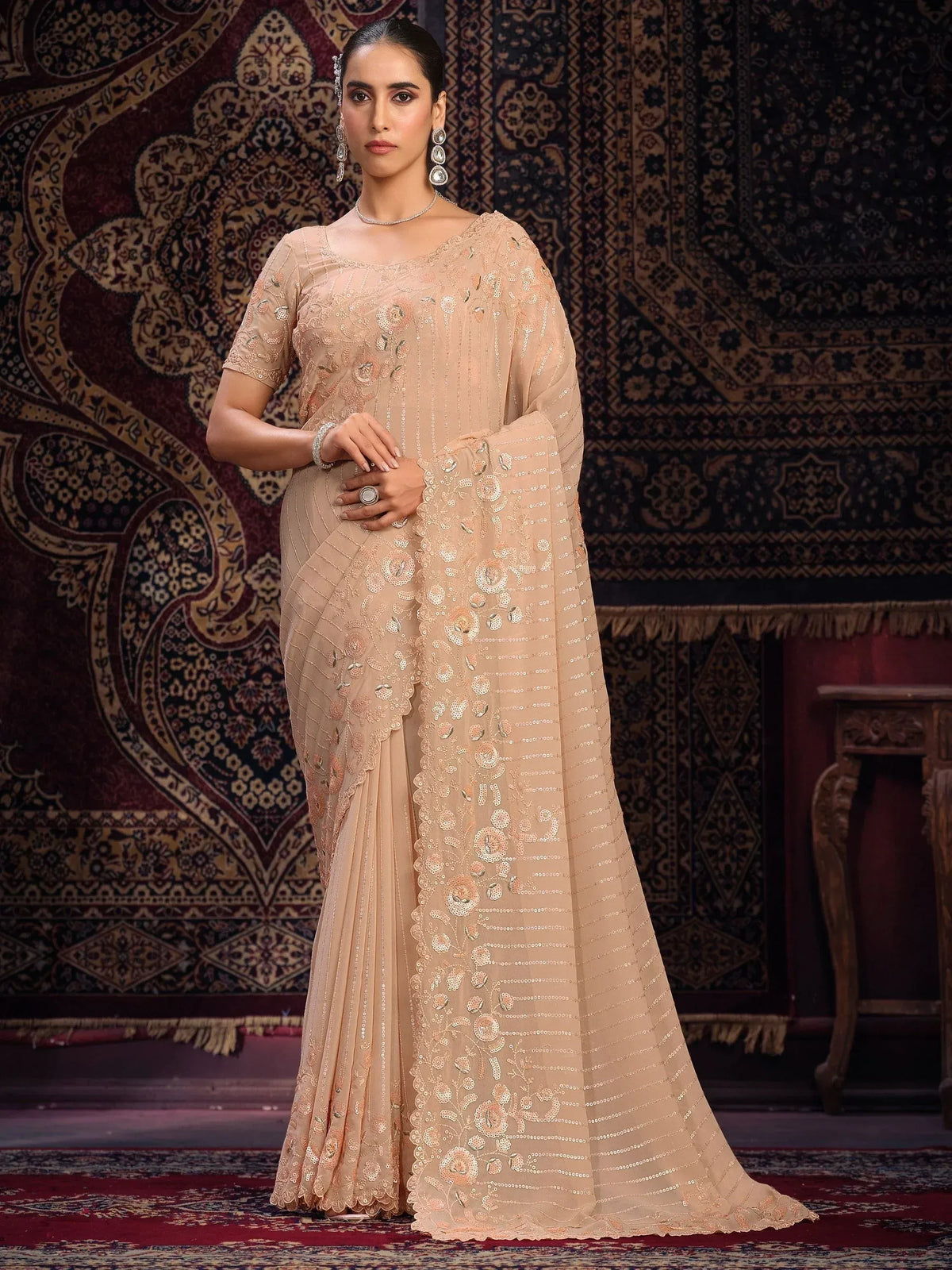 Elegant beige designer saree with floral sequin embroidery, perfect for Indian ethnic occasions.
