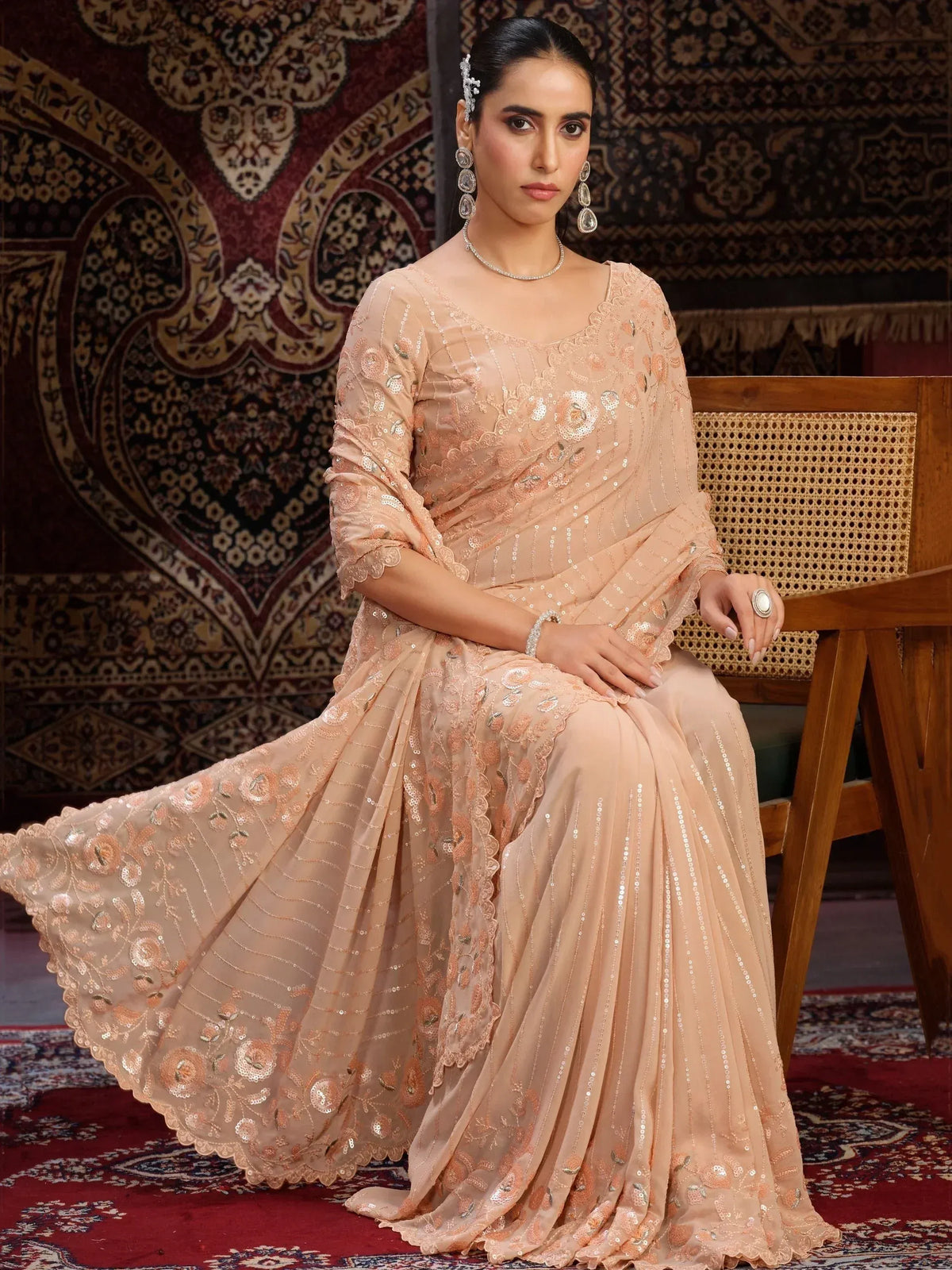 Elegant peach designer lehenga choli with sequin embroidery, perfect for Indian ethnic wear occasions.