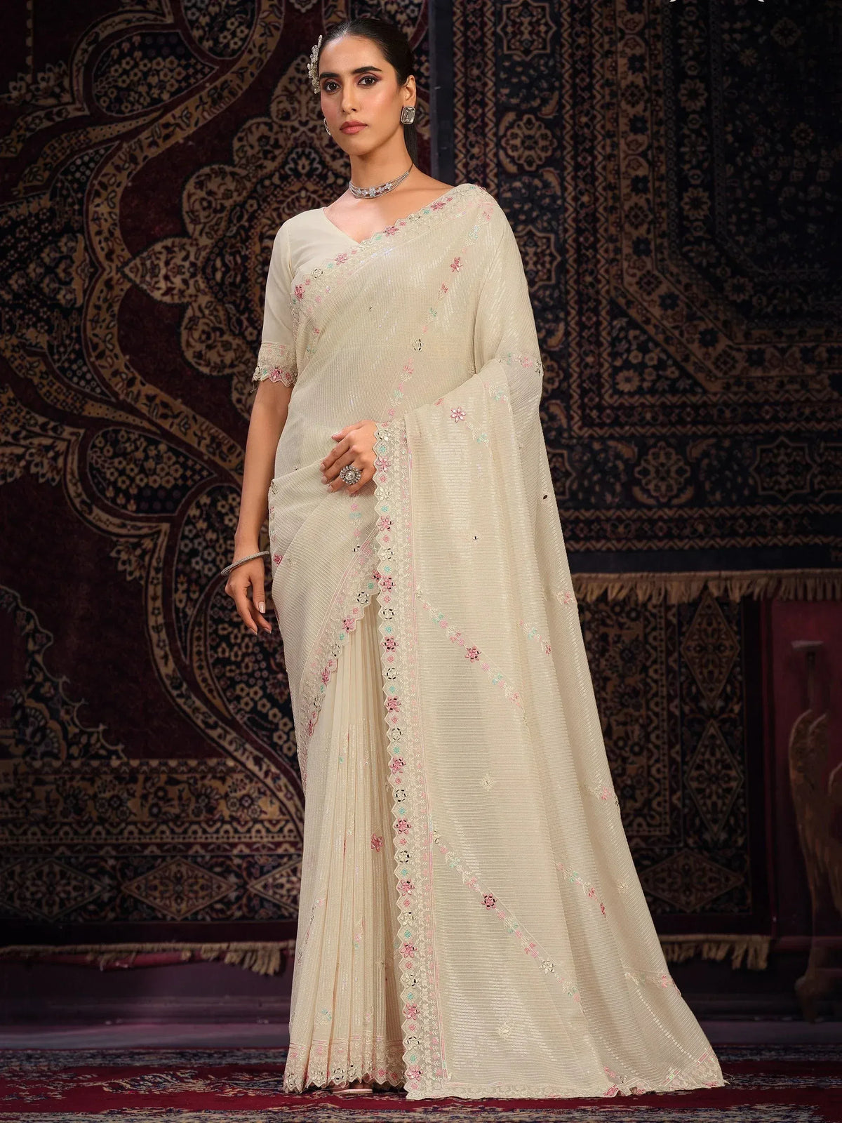 Elegant cream saree with floral embroidery and sequins, perfect for Indian ethnic wear occasions.