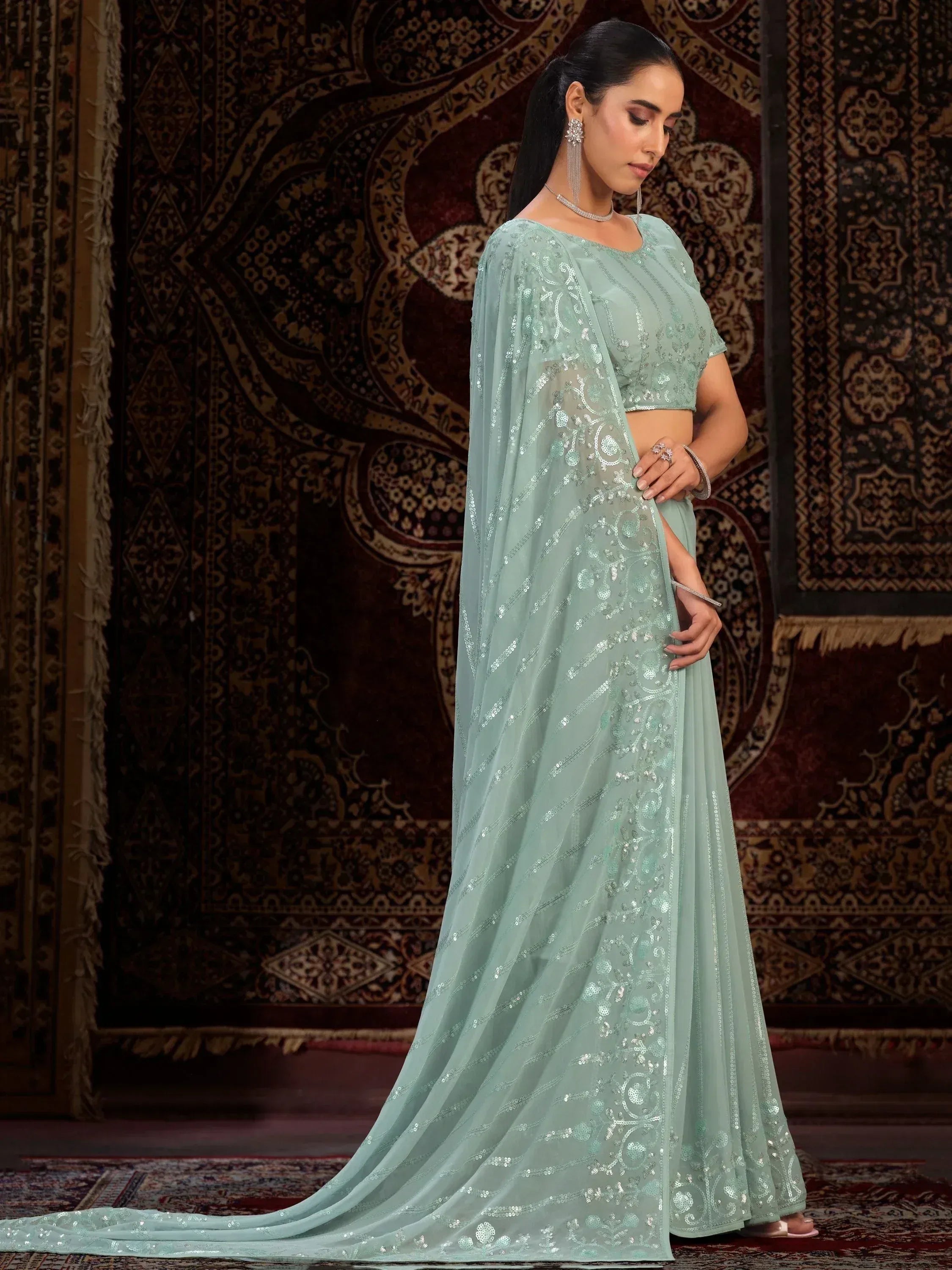 Mint green sequin-embellished ethnic gown with cape, perfect for Indian weddings and parties