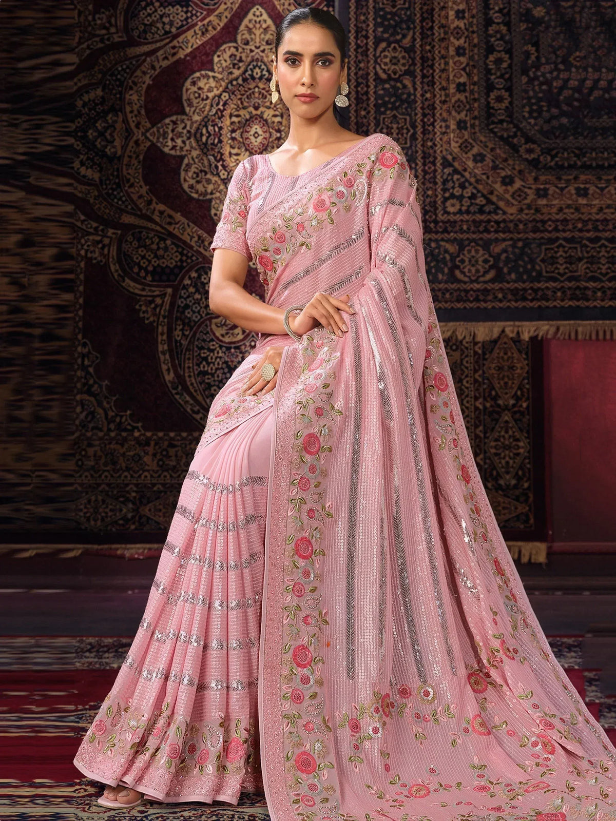 Pink embroidered saree with floral motifs and sequin detailing, perfect for Indian ethnic occasions