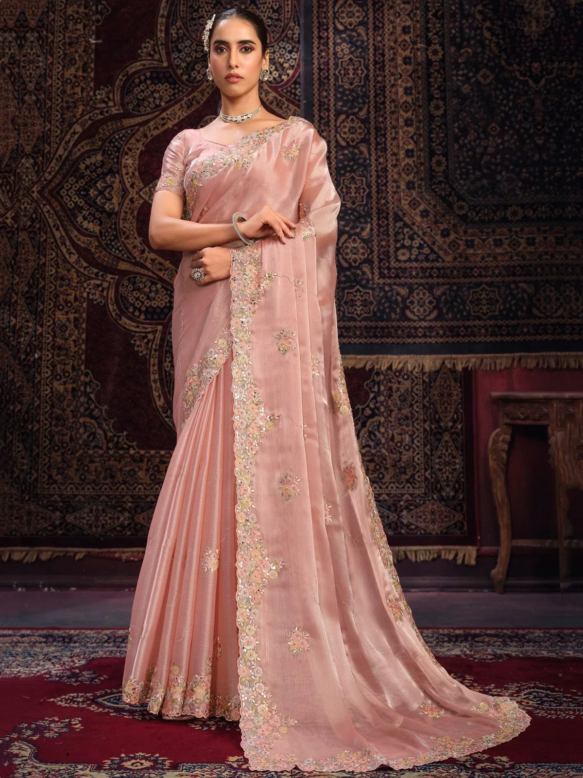 Elegant pink embroidered saree with floral detailing, perfect for Indian ethnic occasions