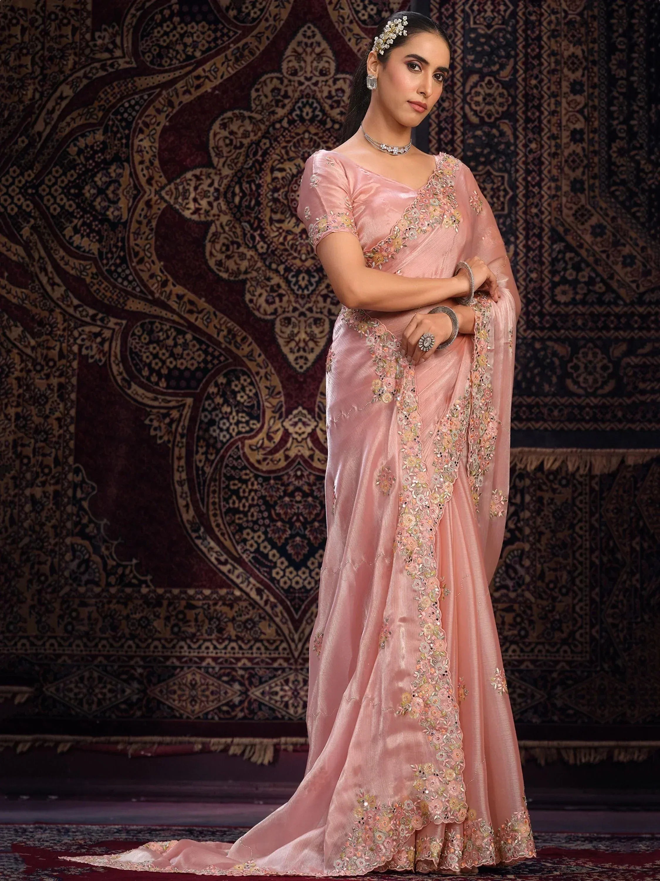 Elegant pink embroidered saree with floral detailing, perfect for Indian ethnic wear occasions