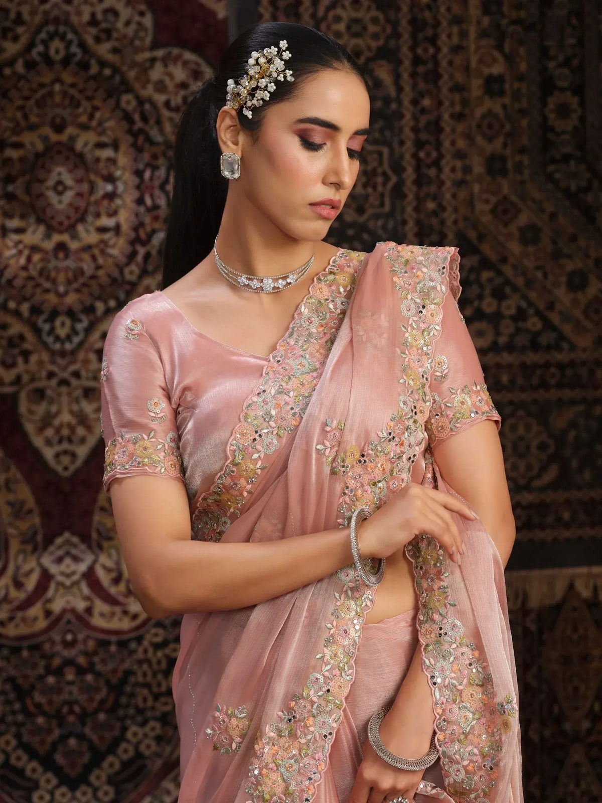 Elegant pink embroidered saree with floral detailing, perfect for Indian ethnic wear occasions