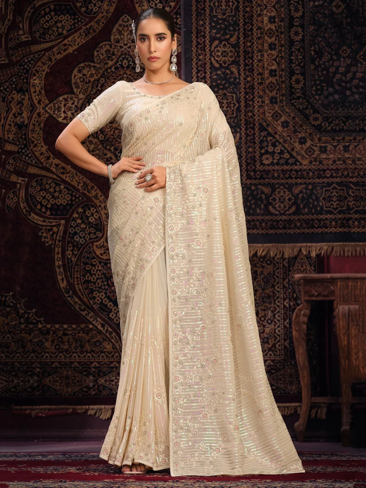 Elegant ivory saree with floral embroidery and sequin work, perfect for Indian ethnic occasions