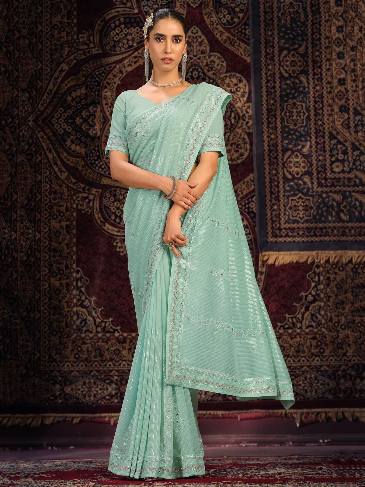Mint green designer saree with sequin embroidery, perfect for Indian ethnic wear occasions