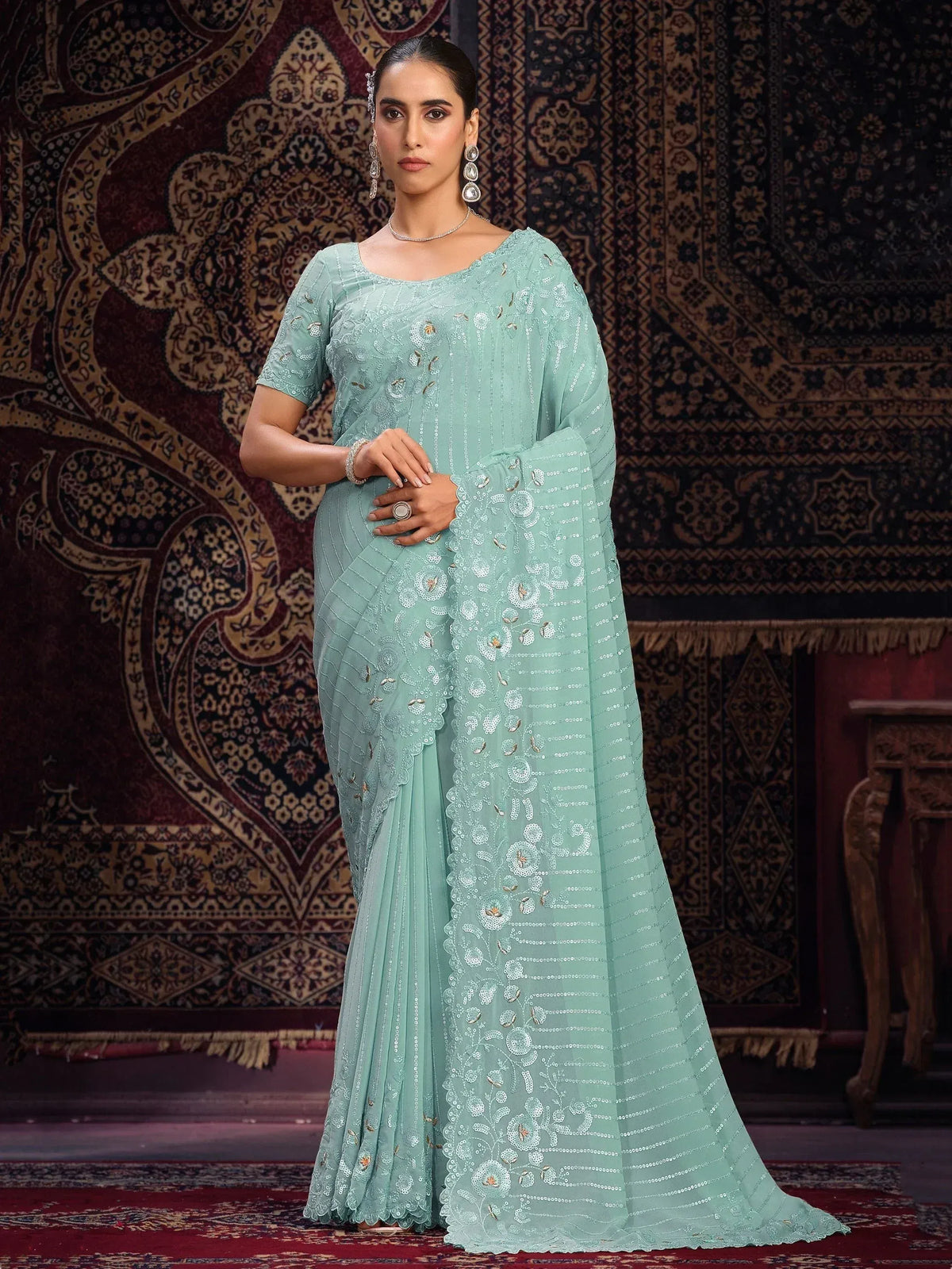 Mint green designer saree with floral sequin embroidery, perfect for Indian ethnic occasions