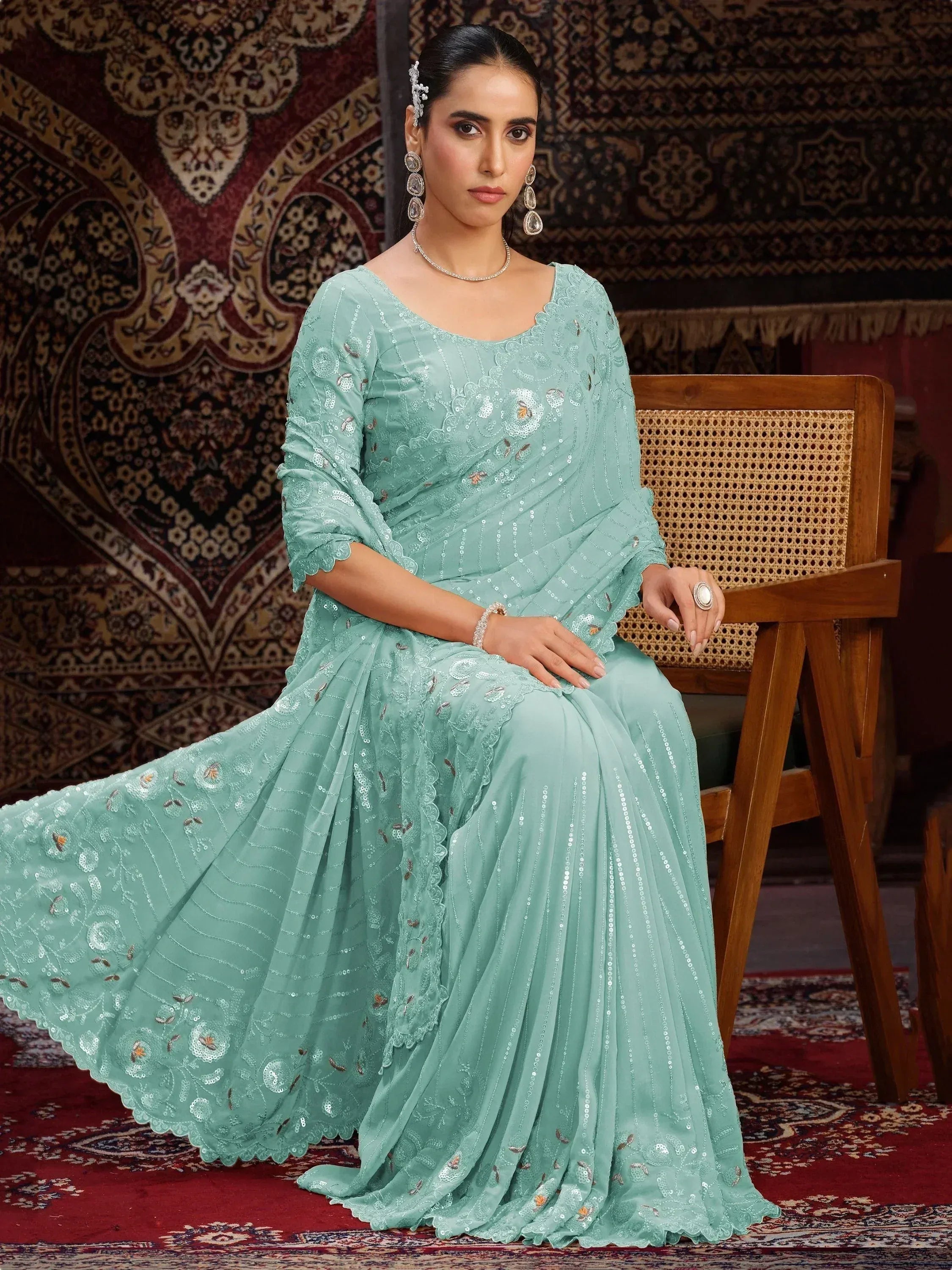Mint green ethnic gown with sequin embroidery, perfect for Indian occasions and festive wear.