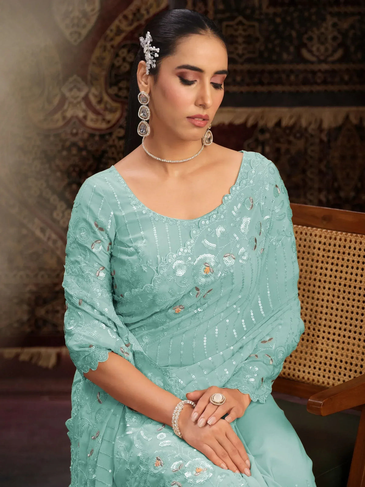 Mint green ethnic gown with sequin embroidery, perfect for Indian occasions and festive wear.
