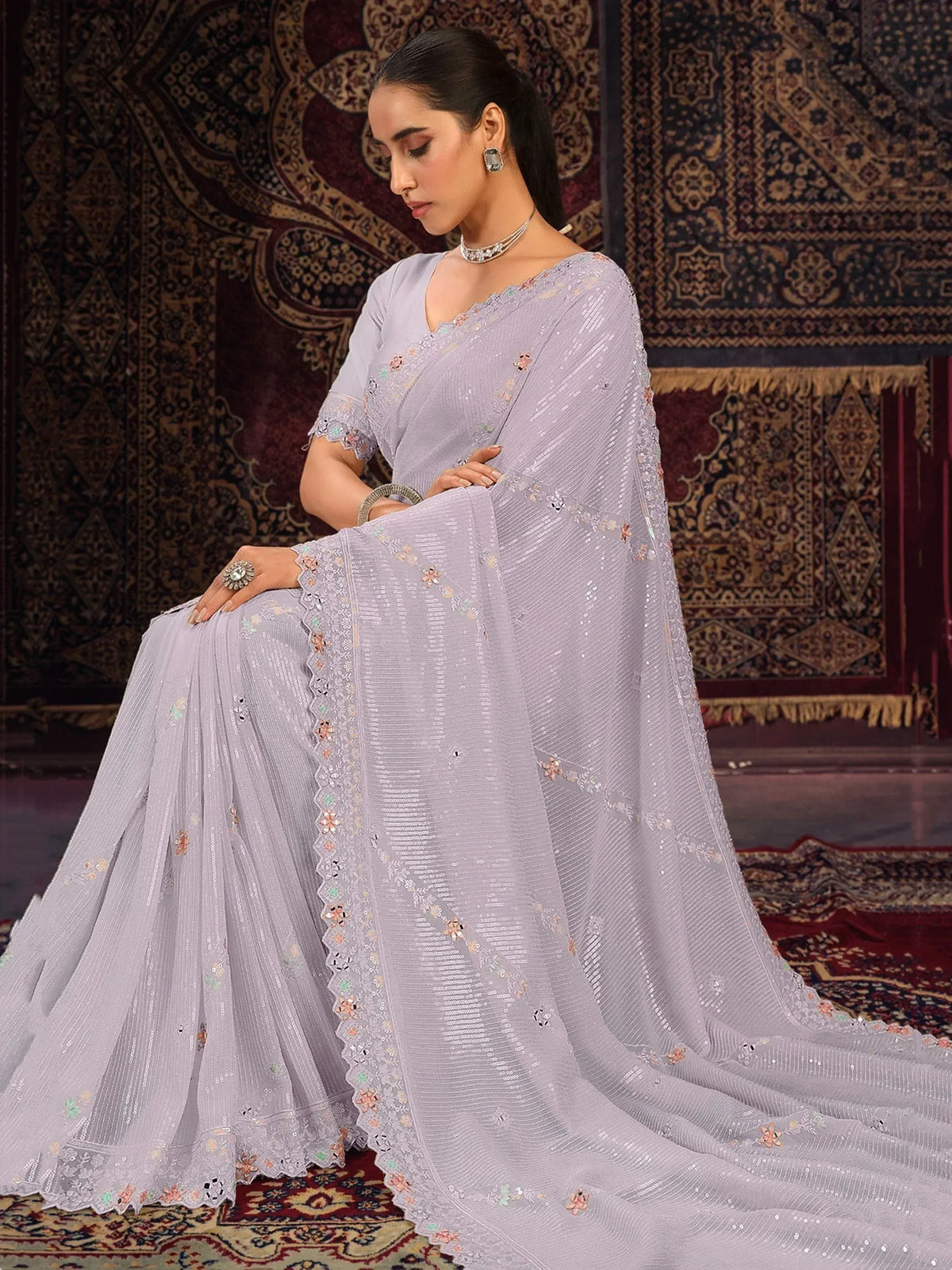 Lavender designer saree with sequin embroidery and floral motifs, perfect for Indian ethnic wear occasions.