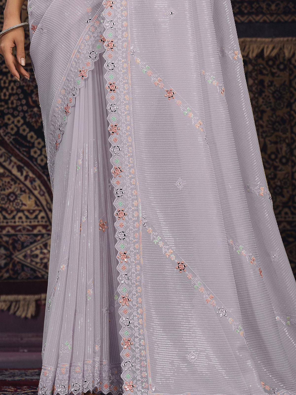 Lavender ethnic gown with floral mirror work and sequin embroidery, perfect for Indian celebrations.