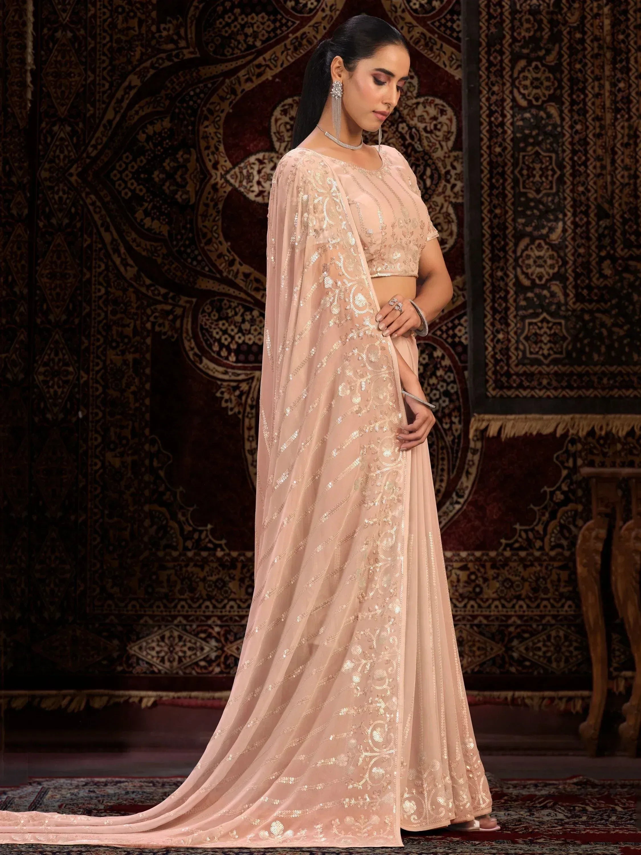 Elegant blush pink designer saree with gold sequin embroidery, perfect for Indian ethnic wear occasions.