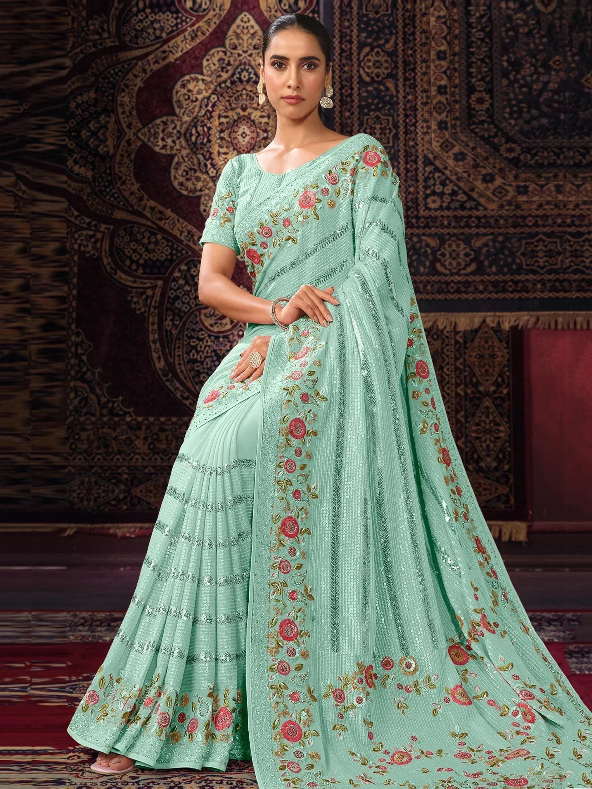 Mint green designer saree with floral embroidery and sequins, perfect for Indian ethnic occasions