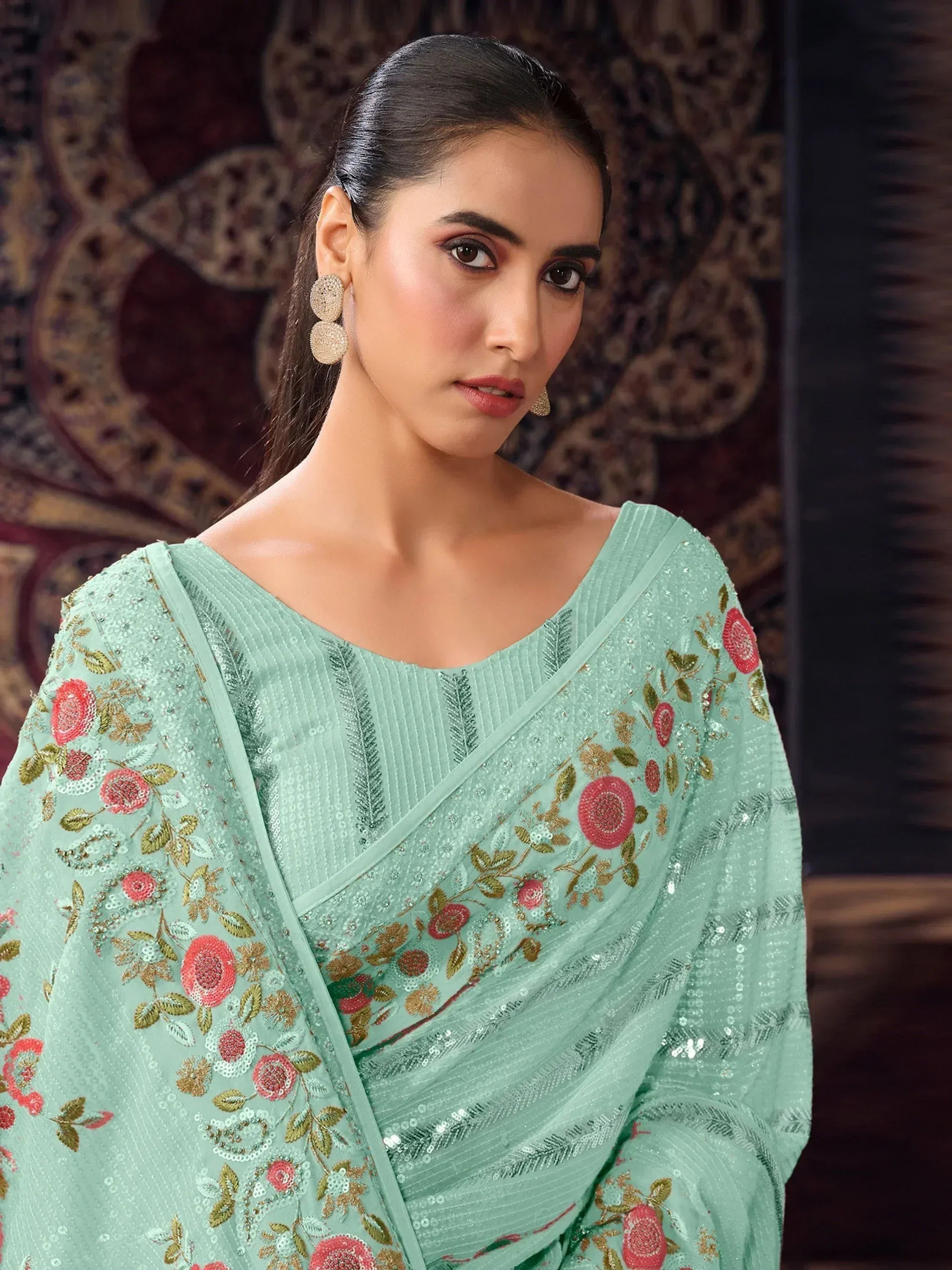 Mint green embroidered saree with floral sequin design, perfect for Indian ethnic wear occasions