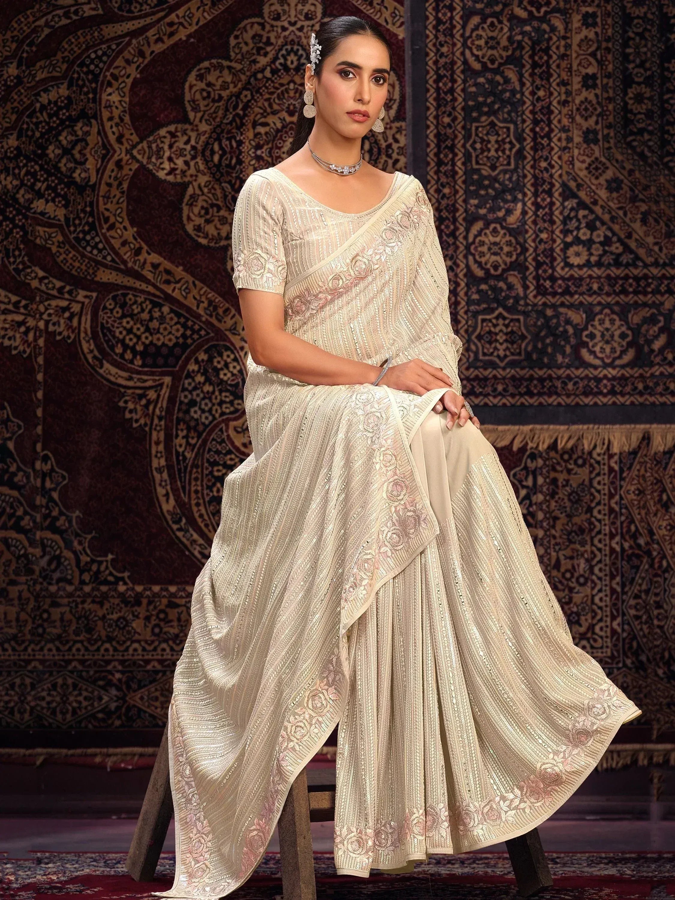 Elegant cream saree with floral embroidery and sequin detailing, perfect for Indian ethnic occasions