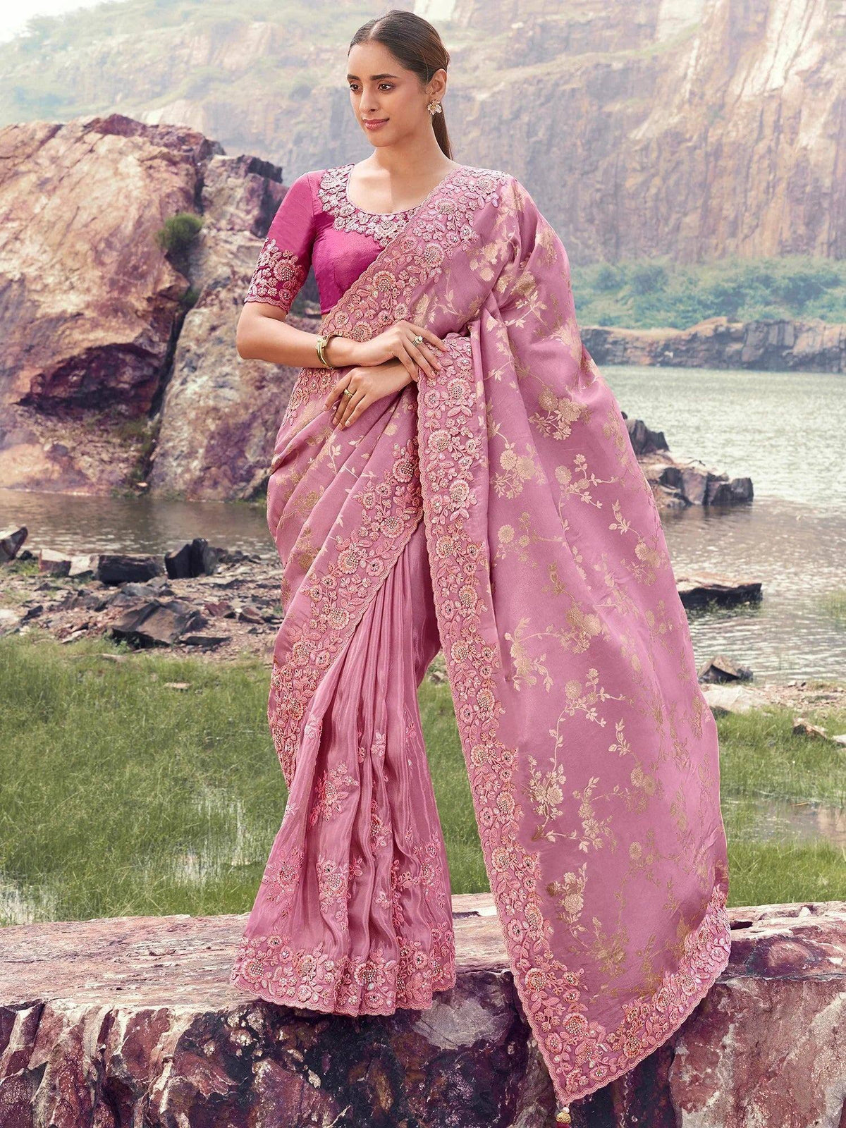 Pink embroidered saree with floral gold detailing, styled with matching blouse, perfect for ethnic occasions
