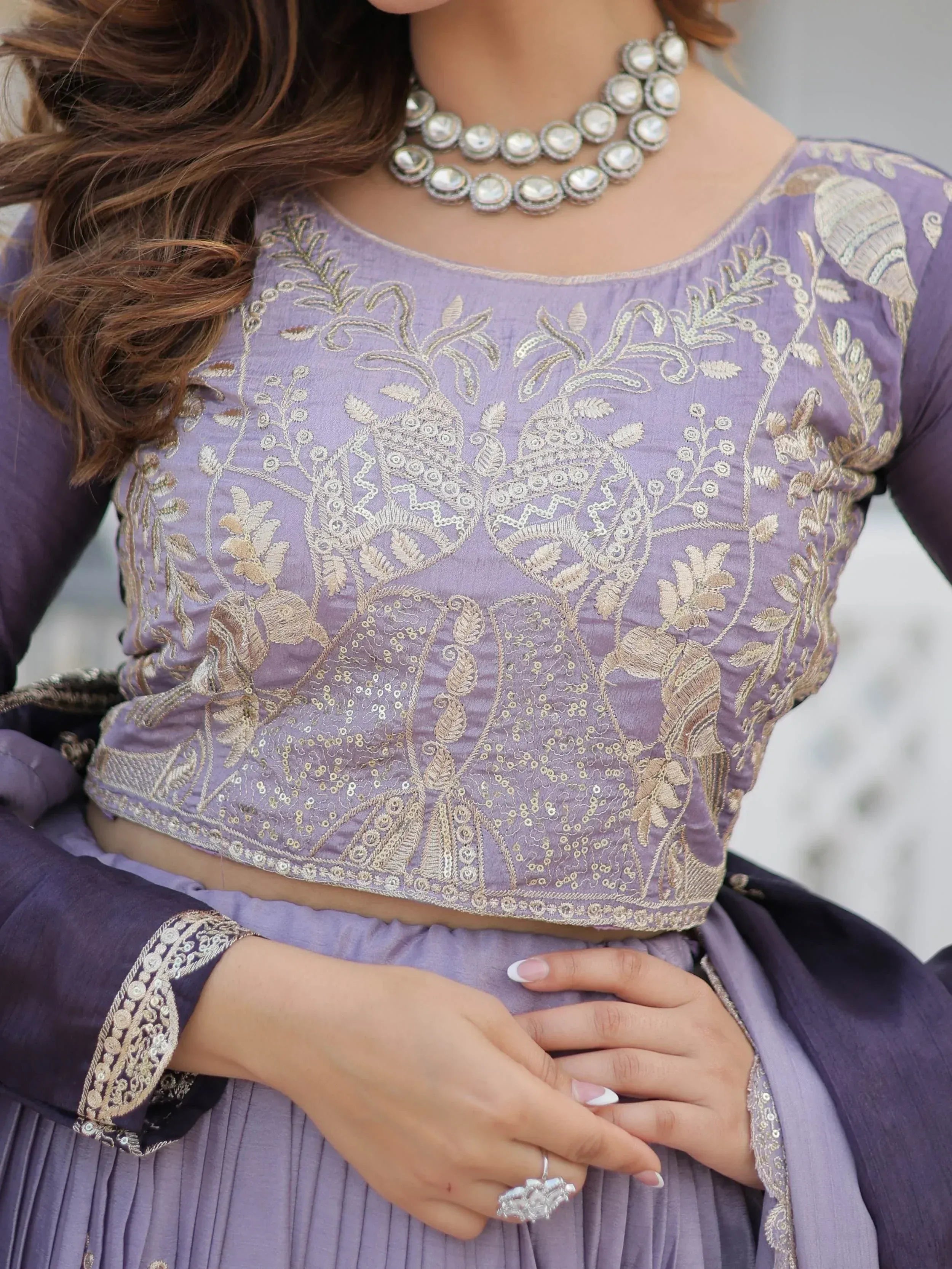 Lavender ethnic blouse with gold embroidery and sequins, paired with matching skirt and statement necklace