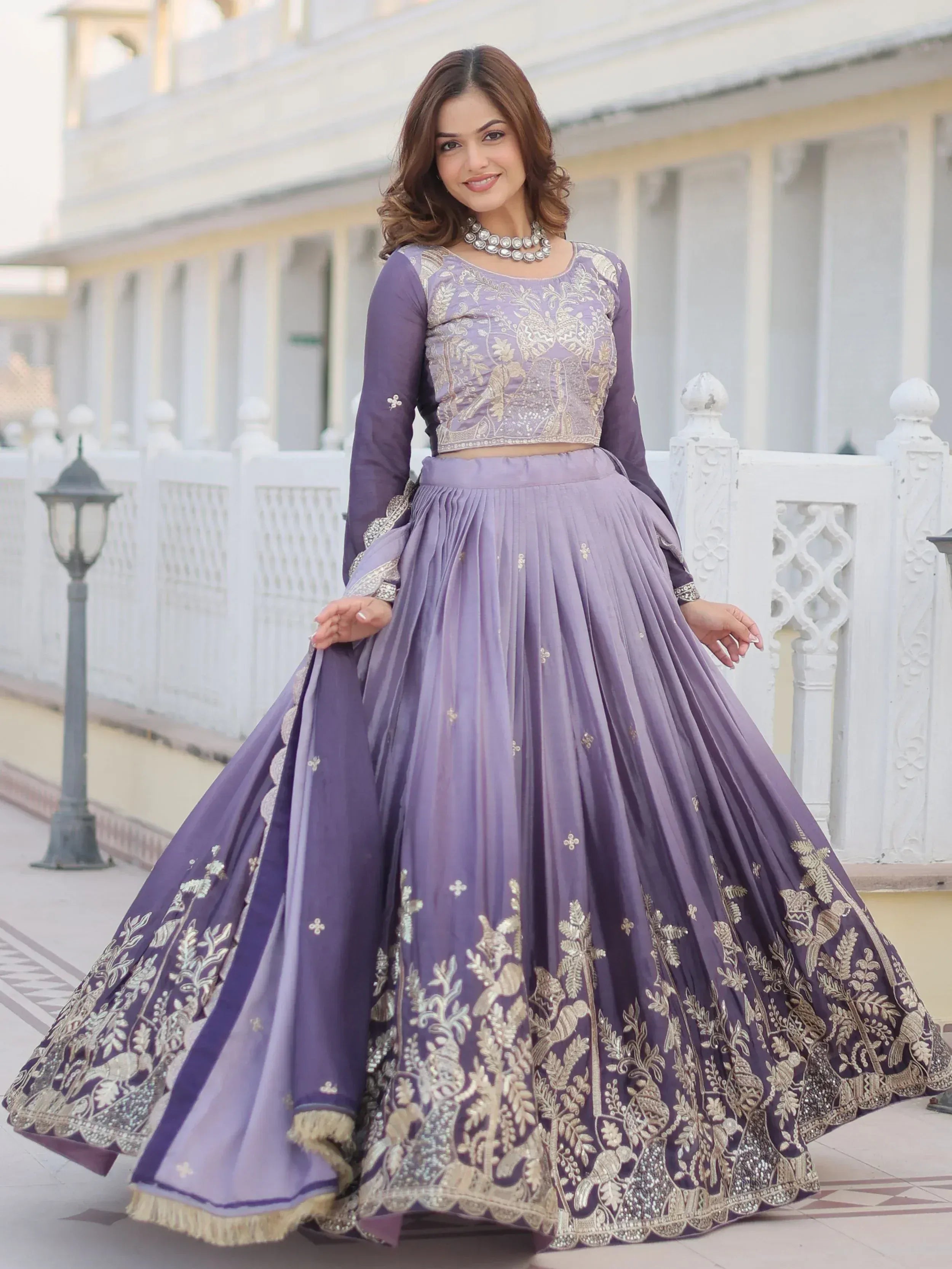 Purple embroidered lehenga choli with gold detailing, perfect for Indian ethnic wear occasions.