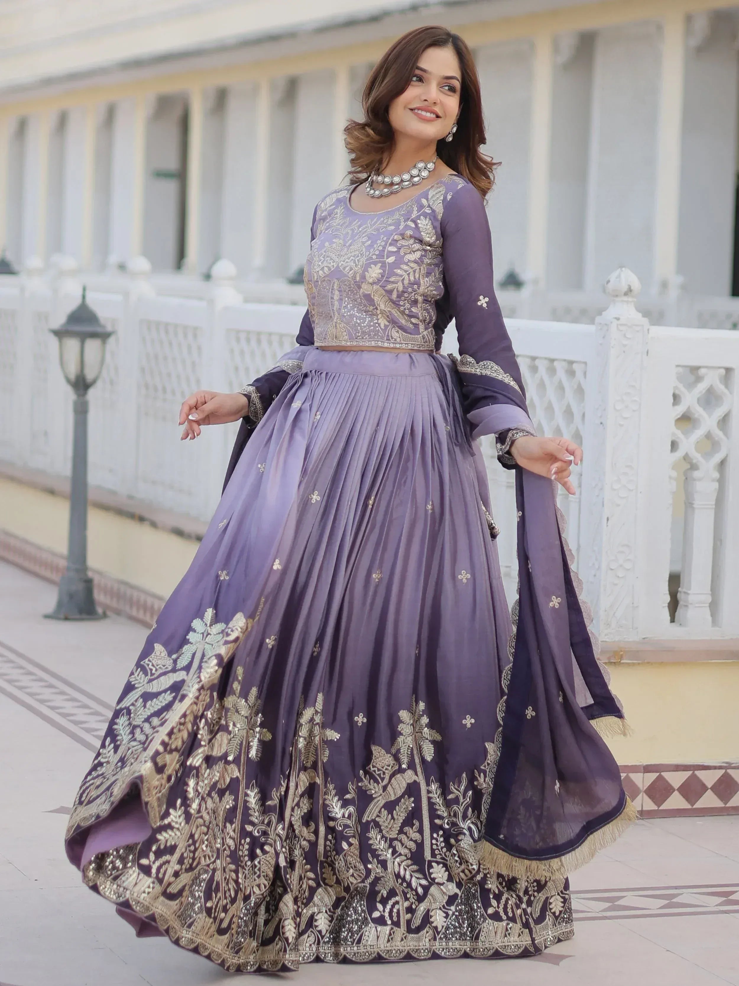 Purple embroidered lehenga choli with gold floral work, perfect for Indian ethnic wear occasions