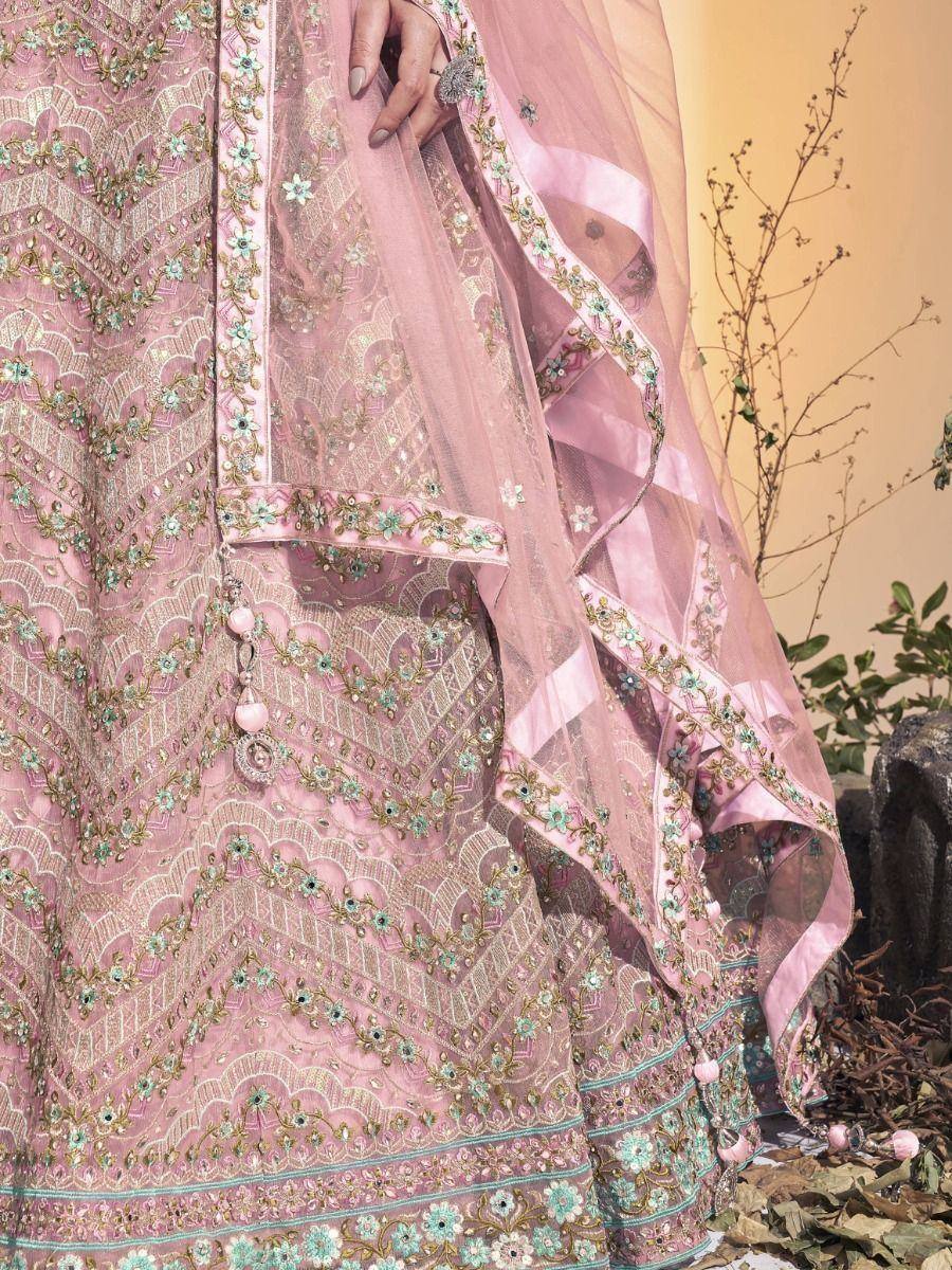 Pink embroidered lehenga choli with floral motifs and sheer dupatta, ideal for Indian ethnic wear
