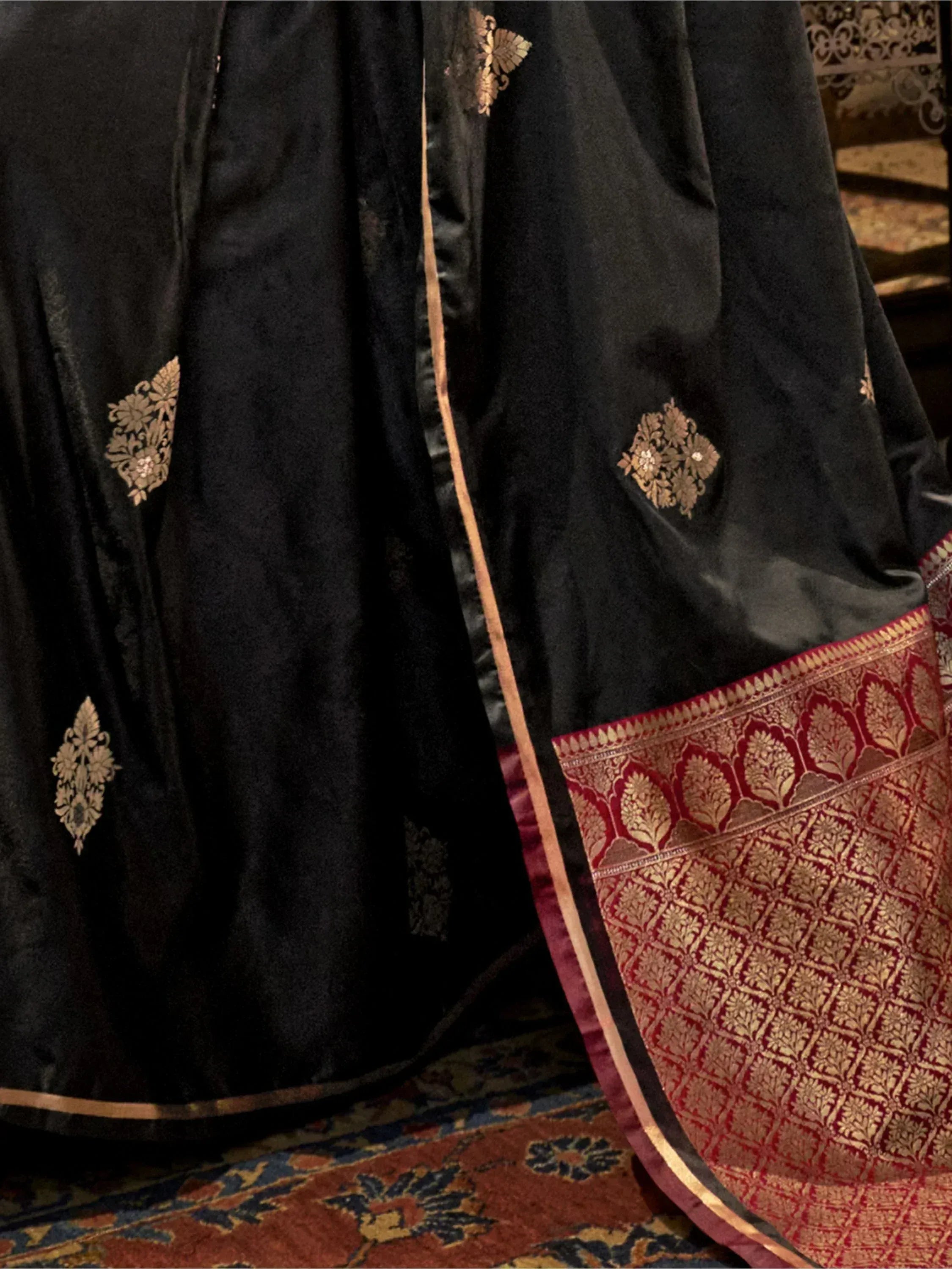 Black velvet lehenga with gold floral embroidery and red gold border, Indian ethnic wear