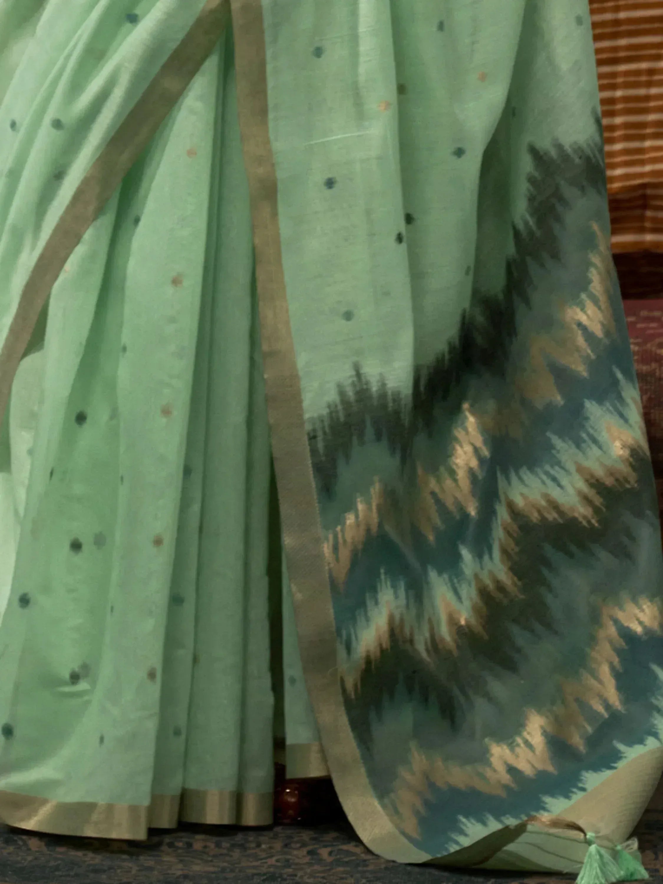 Mint green saree with ikat border and gold trim, ethnic Indian wear