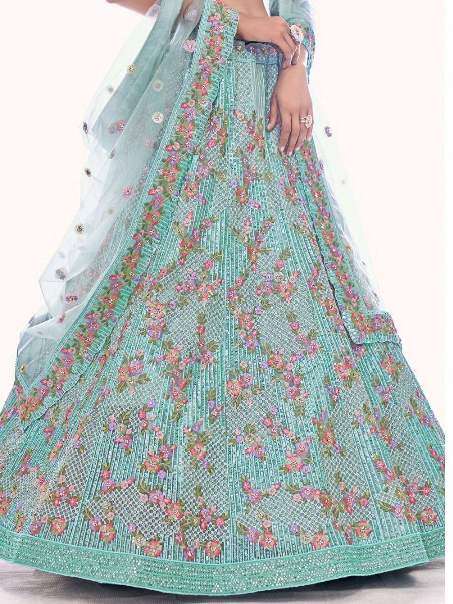 Mint green designer lehenga choli with floral embroidery and net dupatta, perfect for Indian ethnic wear occasions.