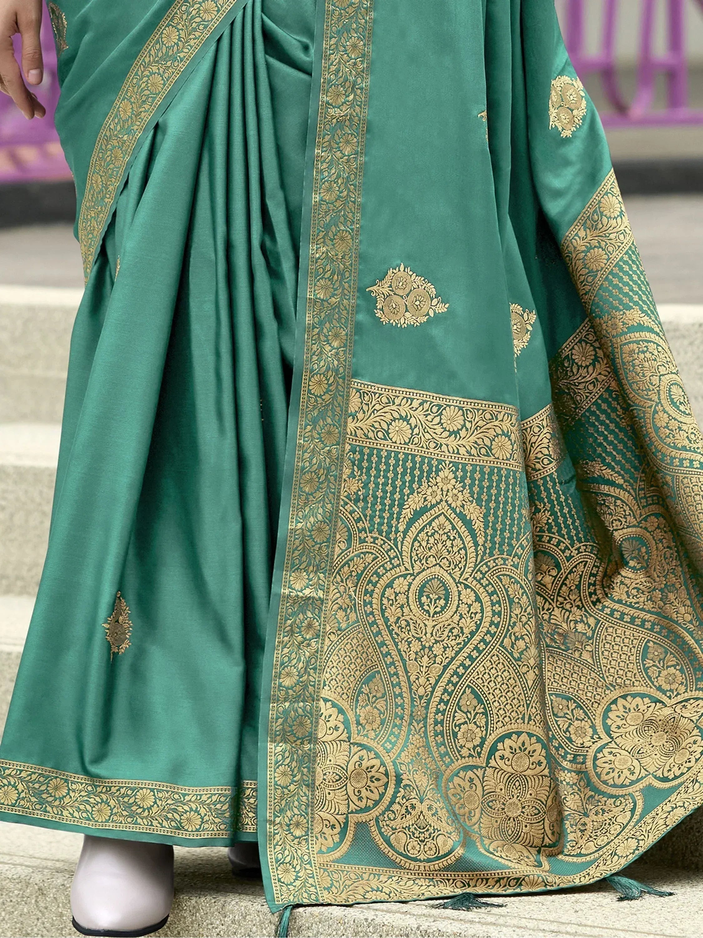 Teal green saree with gold zari embroidery and floral motifs, ethnic Indian wear
