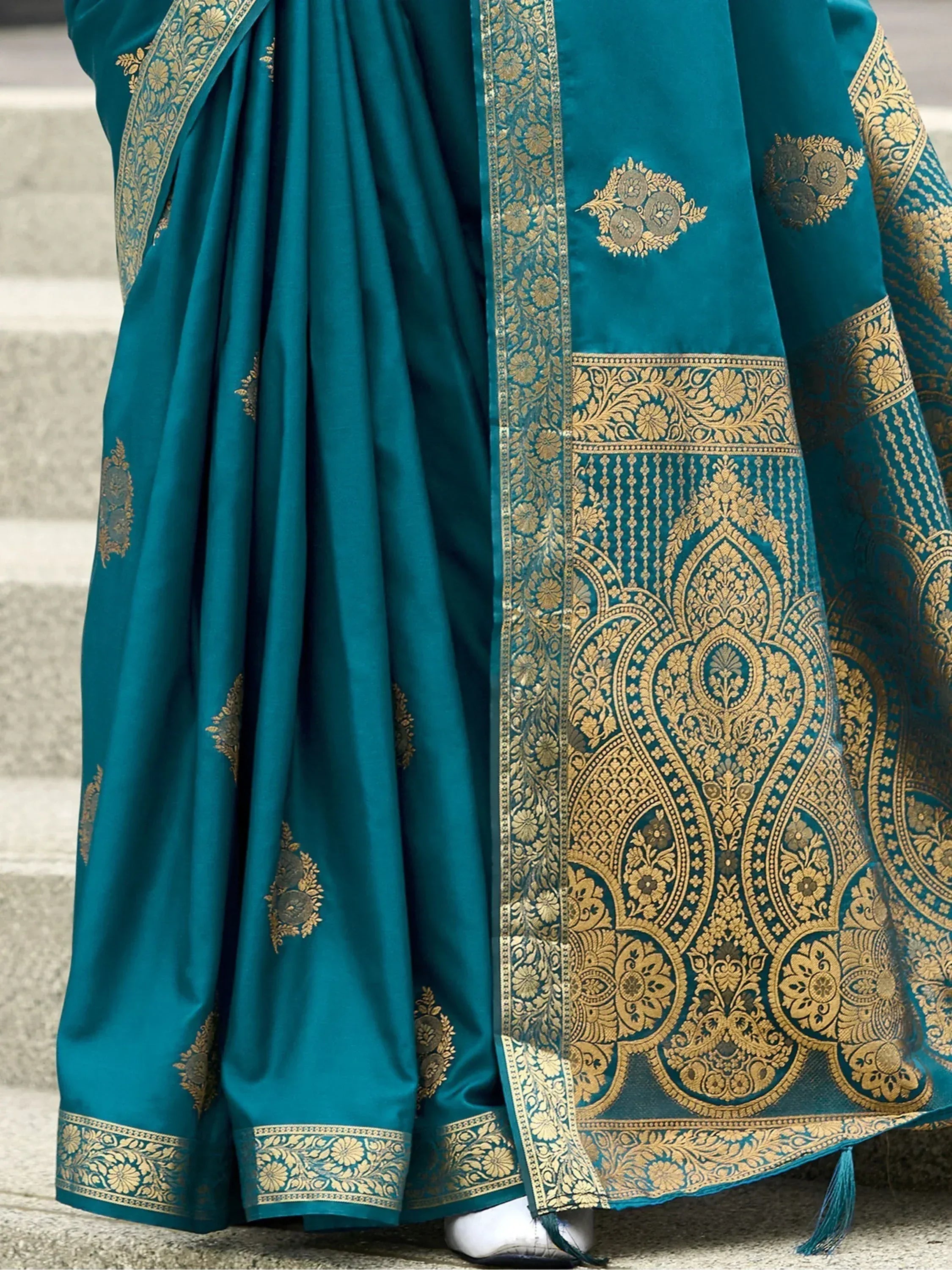 Teal silk saree with gold zari embroidery, perfect for Indian ethnic wear and festive occasions.