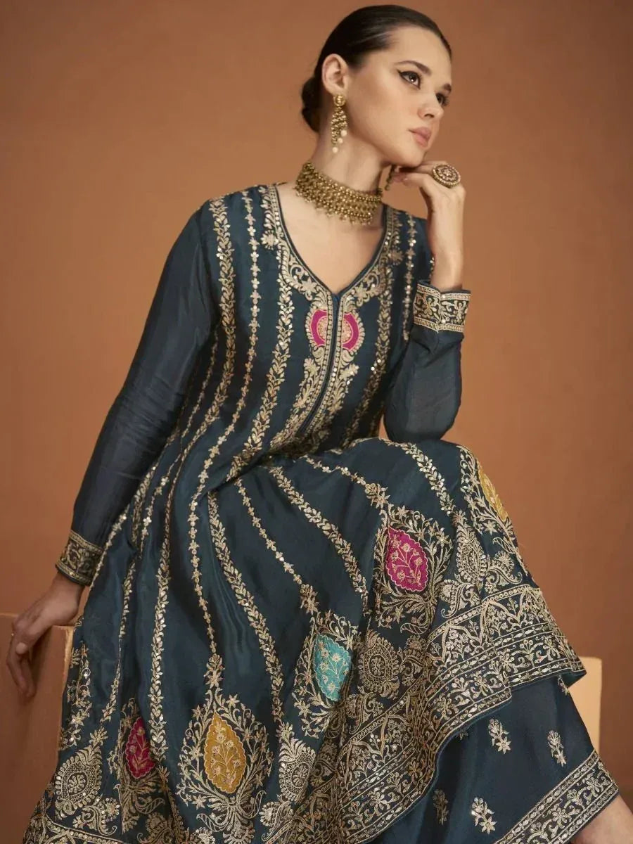 Elegant navy blue embroidered anarkali gown with gold and pink detailing, perfect for Indian ethnic occasions