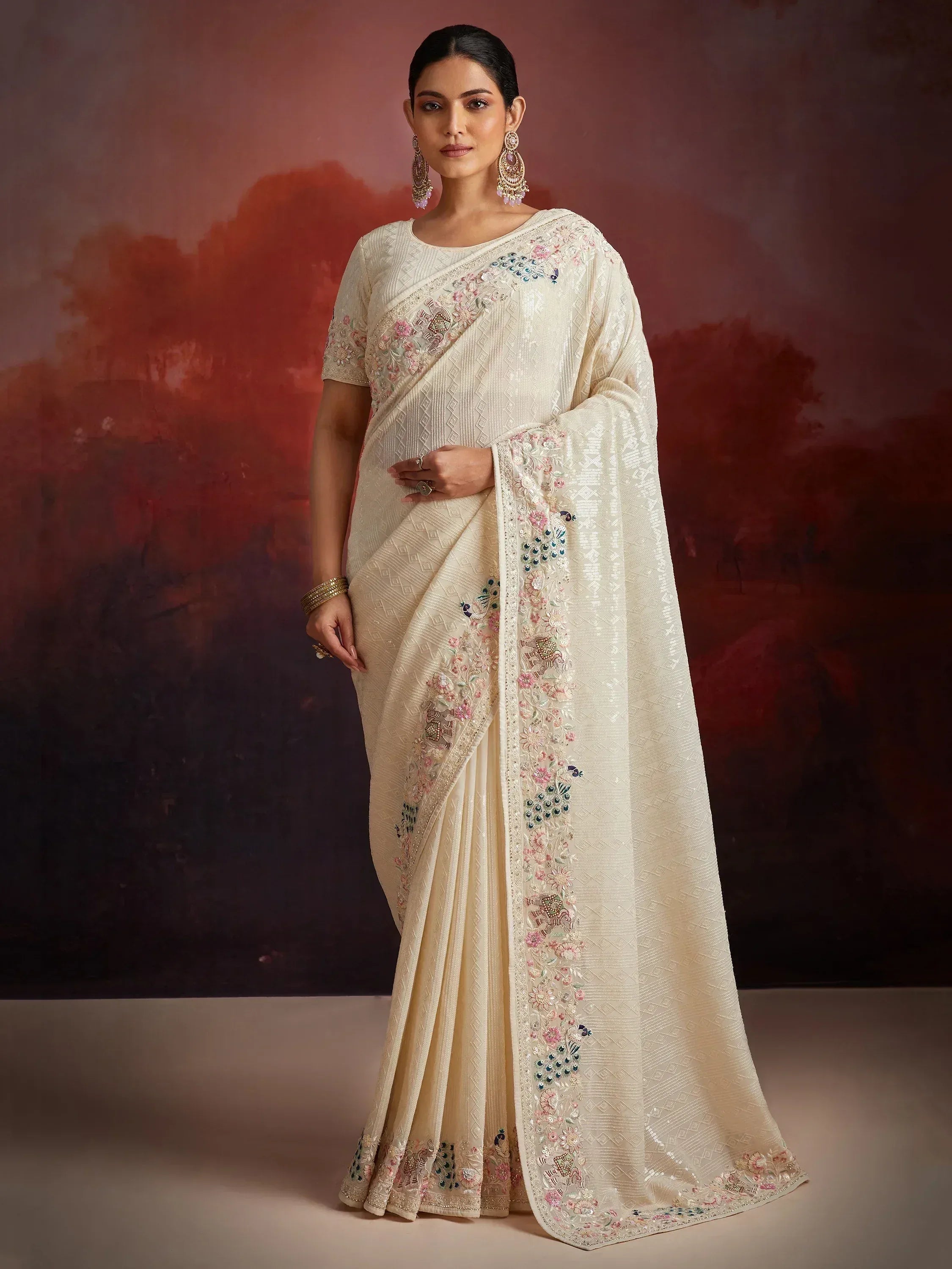 Cream embroidered saree with peacock and floral motifs, perfect for Indian ethnic occasions