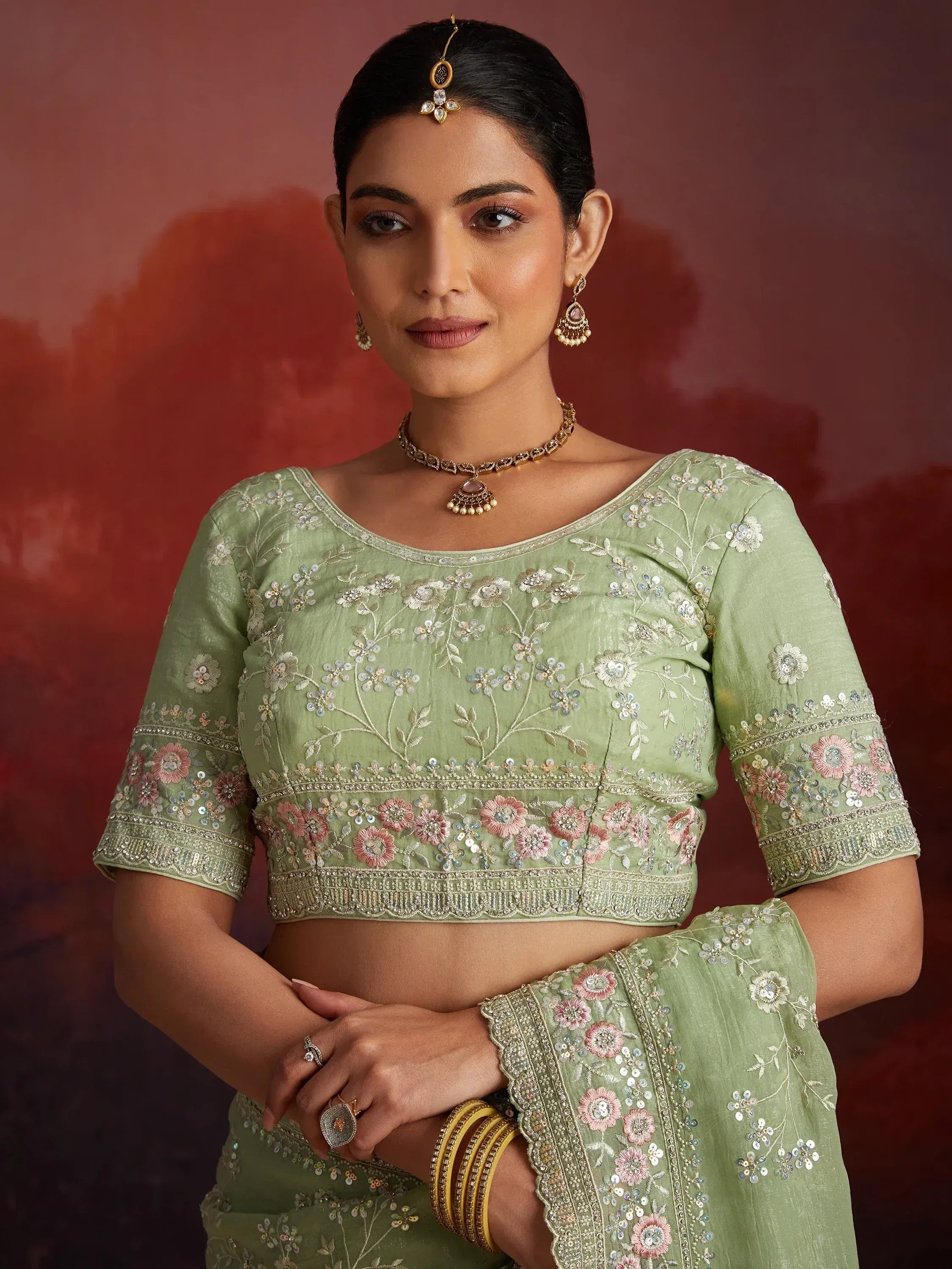 Mint green embroidered lehenga choli with floral sequin work, perfect for Indian ethnic occasions
