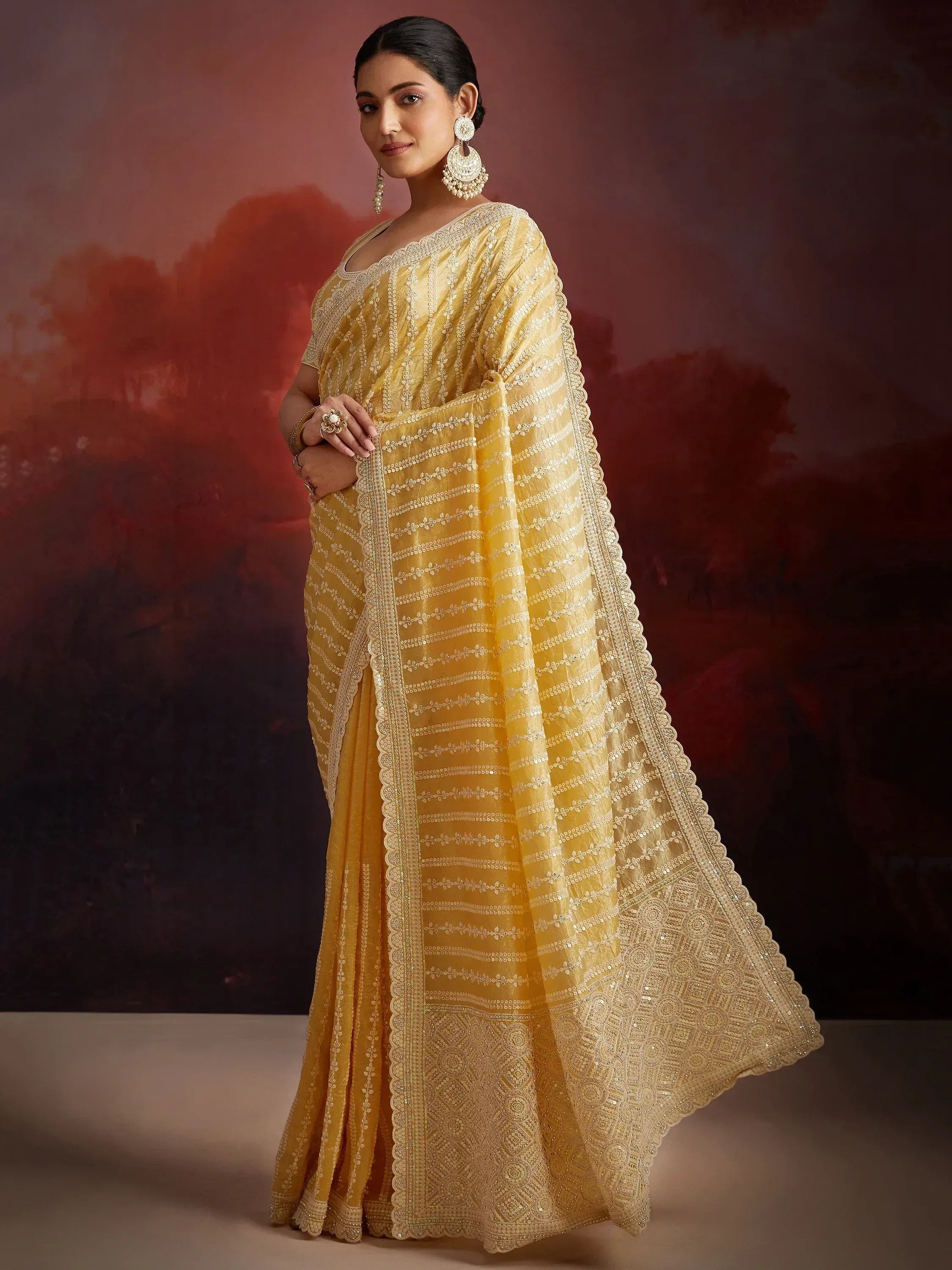 Yellow embroidered saree with scalloped border, perfect for Indian ethnic wear occasions