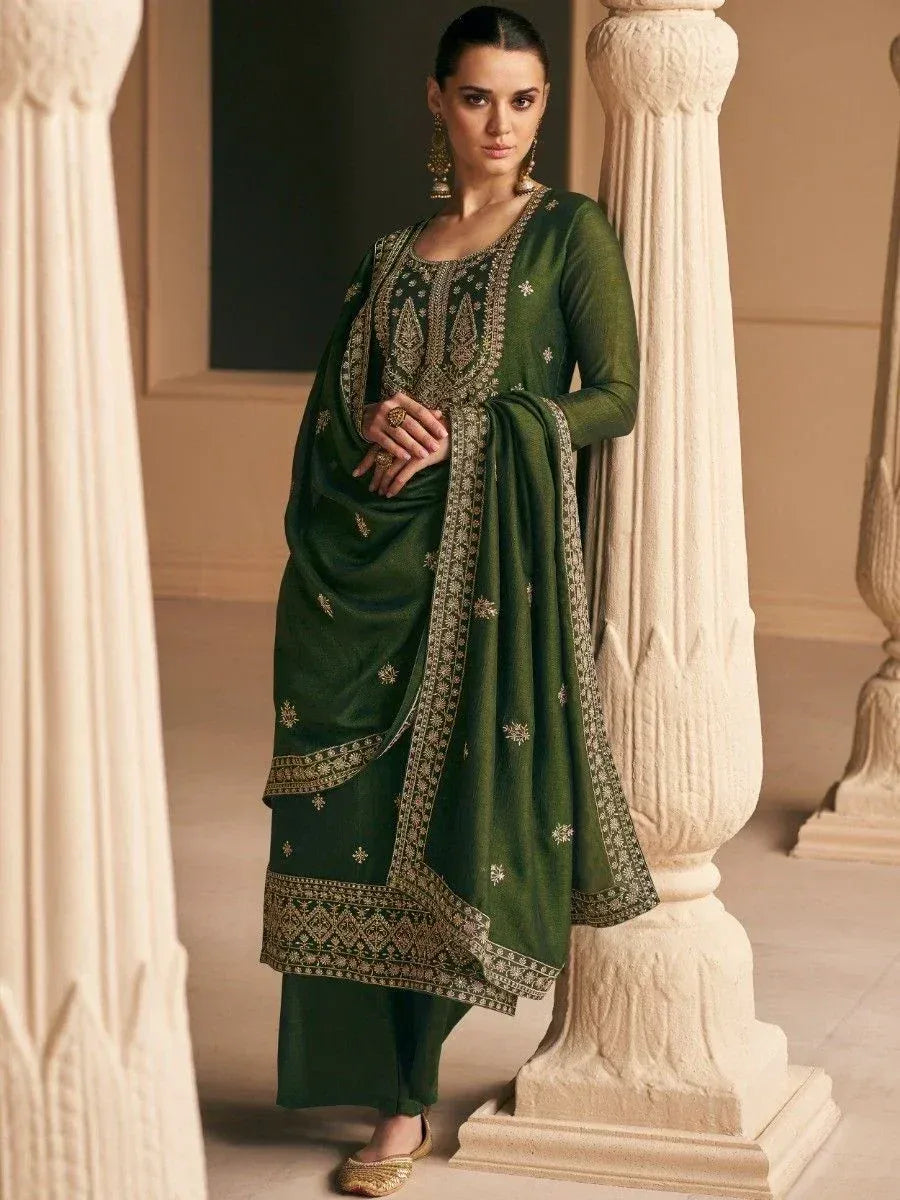 Emerald green embroidered salwar kameez with gold detailing, perfect for Indian ethnic wear occasions.