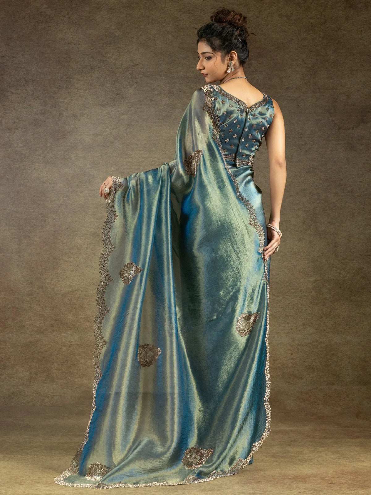 Teal silk saree with gold embroidery, elegant Indian ethnic wear for women