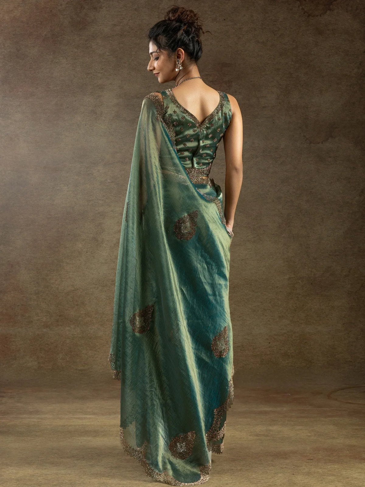 Elegant green saree with golden embroidery and designer blouse for Indian ethnic wear